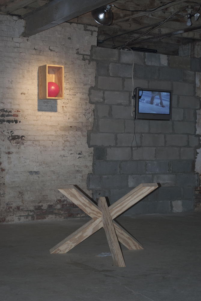 Thomas Stevenson "Pink ball", 2011, soccer ball, paint, wood, 12 x 24 x 6 inches, and "X", 2011, wood, paint, glove, crystals, dimensions variable Julie Lohnes "TREAD", 2007, single channel video, 1.22 minutes and "CLIMB" single channel video, 1.02