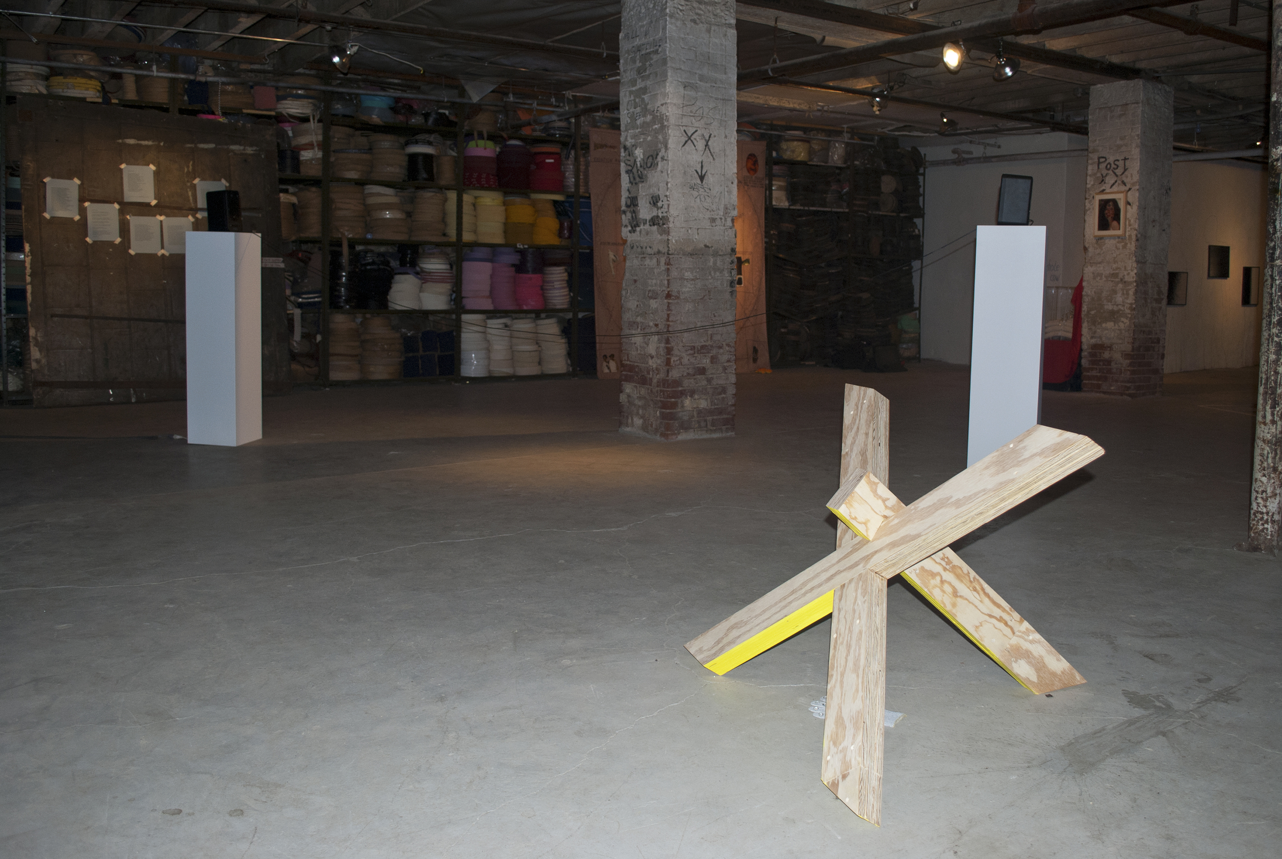 Thomas Stevenson "Pink ball", 2011, soccer ball, paint, wood, 12 x 24 x 6 inches, and "X", 2011, wood, paint, glove, crystals, dimensions variable Rebecca Gilber "Hush", 2010, 2-Channel audio, speakers, RCA cable, pedestals, 10:30 minutes, loop, dim