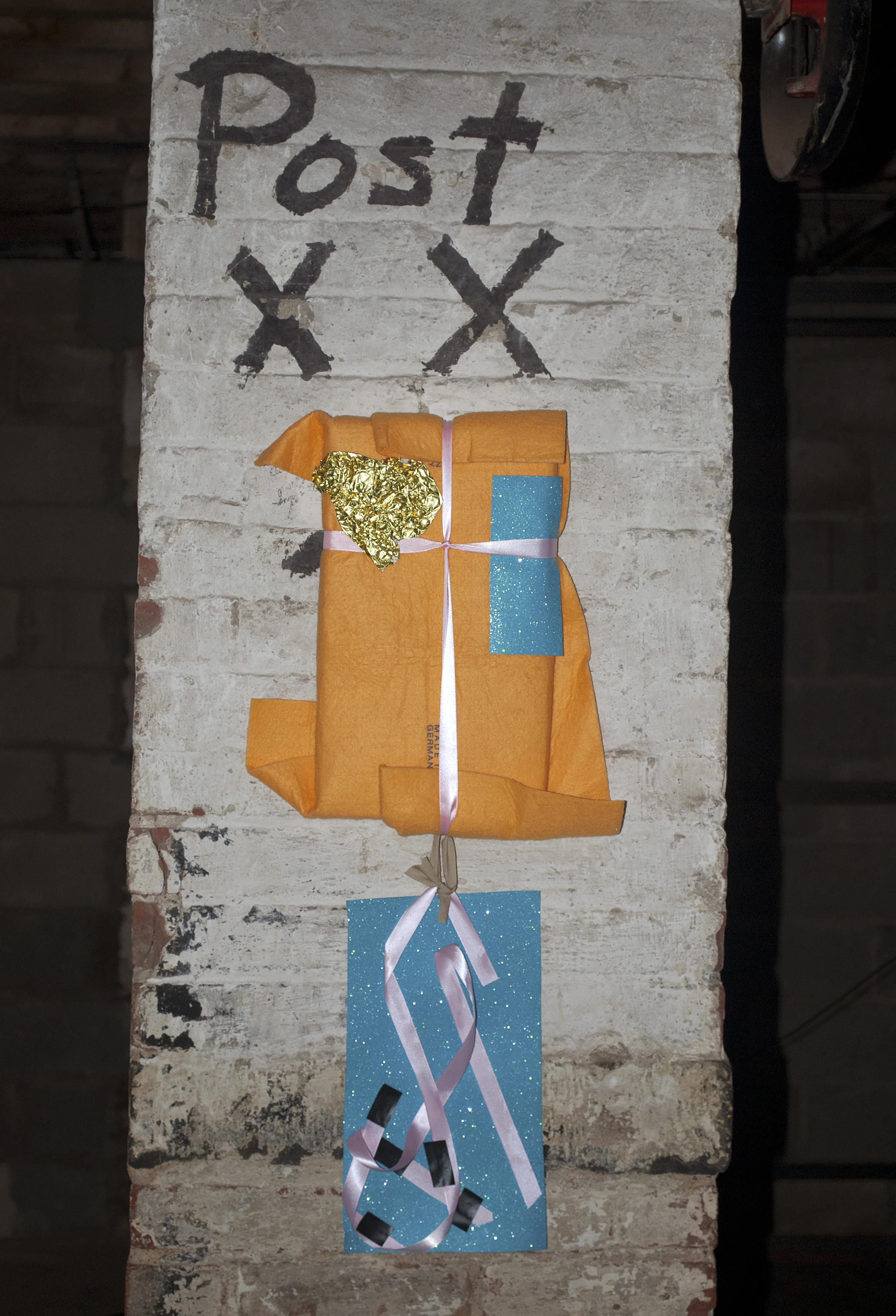 Shannon McIntyre "You are someone's festivity", 2010, foam, wood, ribbon, tape, wrapping paper. 8 x 24 inches