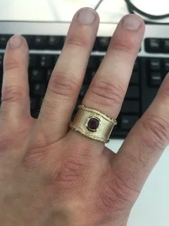 And the ring on his hand ;)