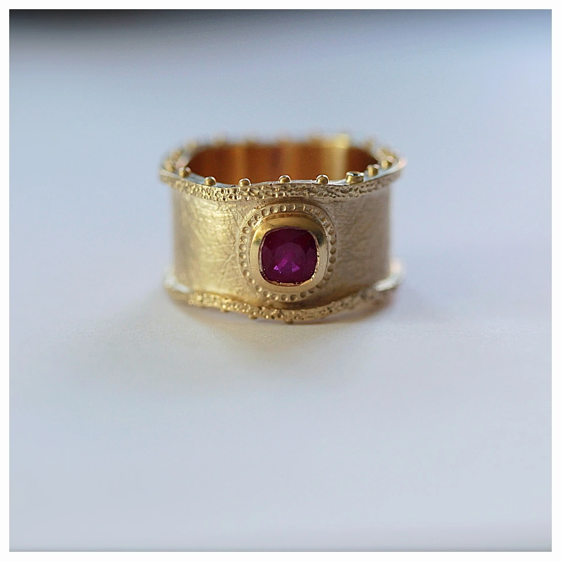 The final piece was cast in 10K yellow gold and features a gorgeous Ruby center and one gray diamond in the top right.It was such an honor to make this ring and help bring something Tys had only imagined and thought about to life. Wishing much conti…