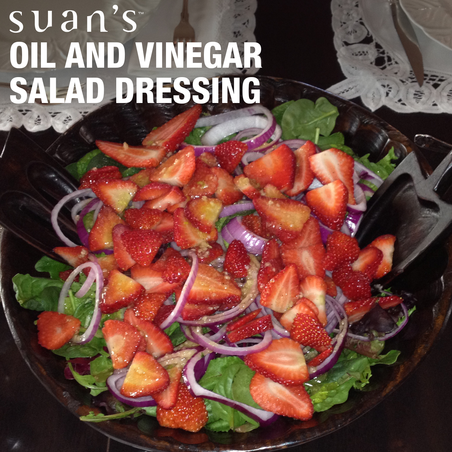 Photo includes mixed greens, red onions and fresh strawberries with Suan's ® Oil and Vinegar Dressing