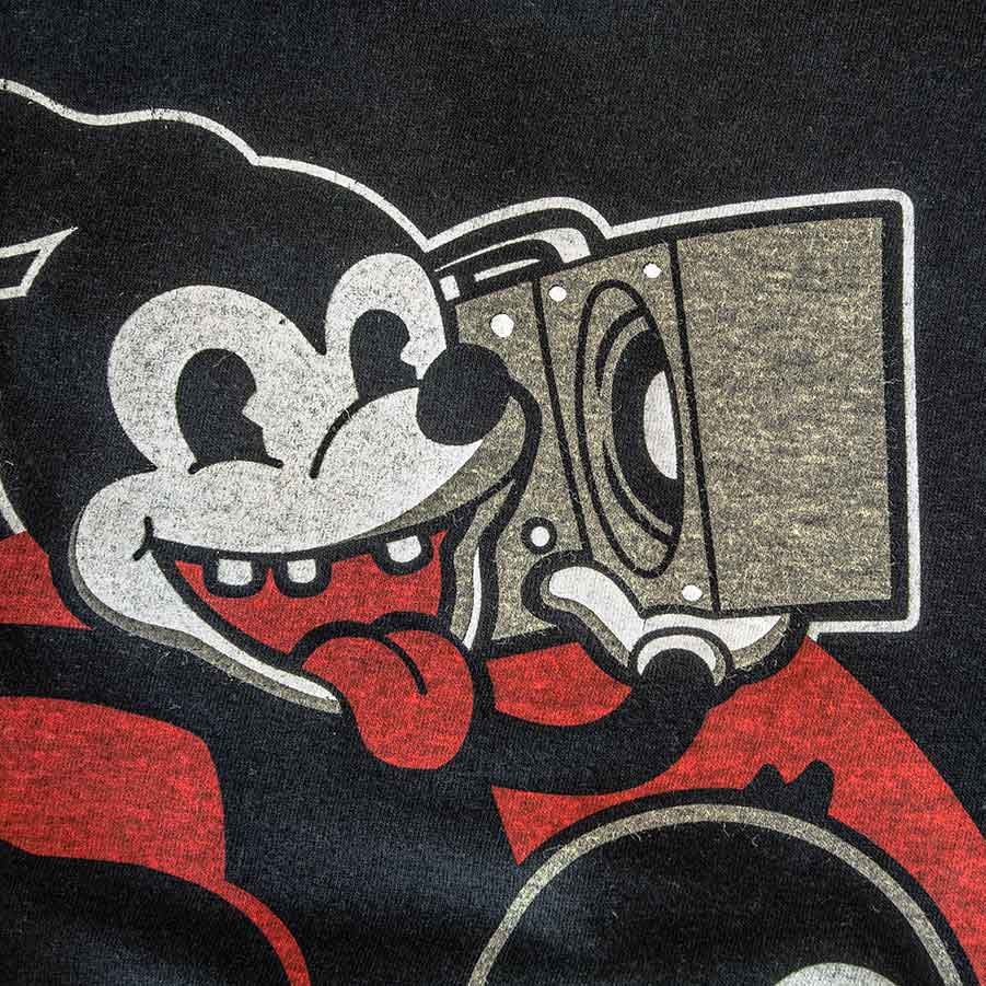 This VINTAGE looking print is achieved using discharge inks on a cotton/polyester blended garment.