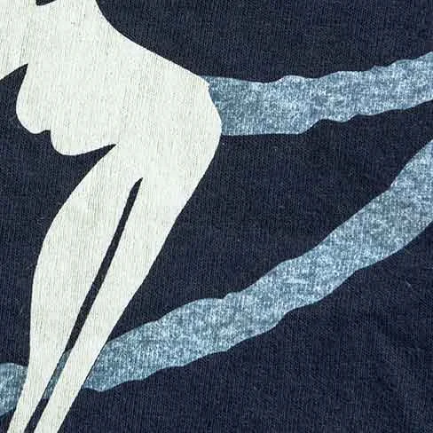 Here you can see both discharge and water-based side by side. The SOLID white is discharge and the VINTAGE look is water-based. On 100%cotton shirt