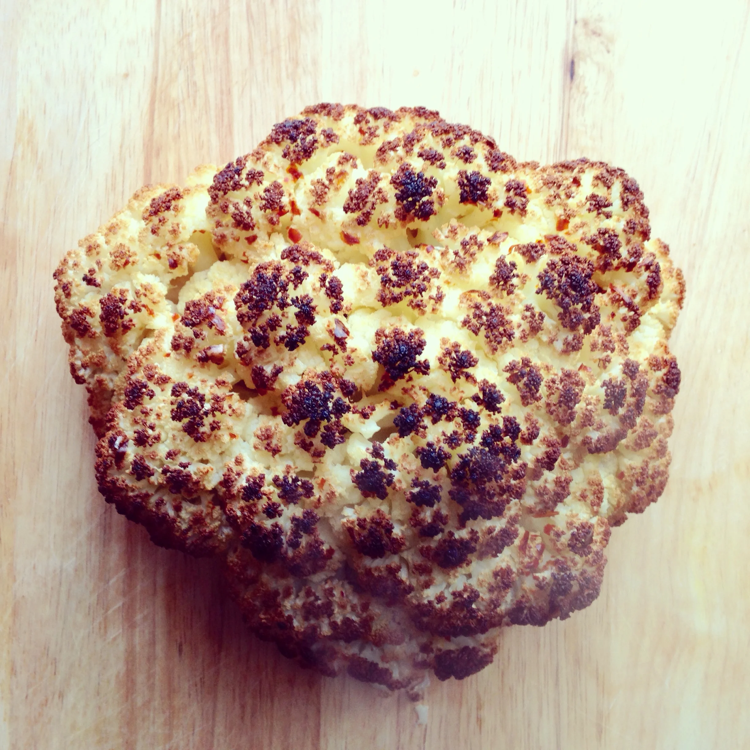  Roasted whole cauliflower. Poached in a white wine &amp; spices first.&nbsp; 