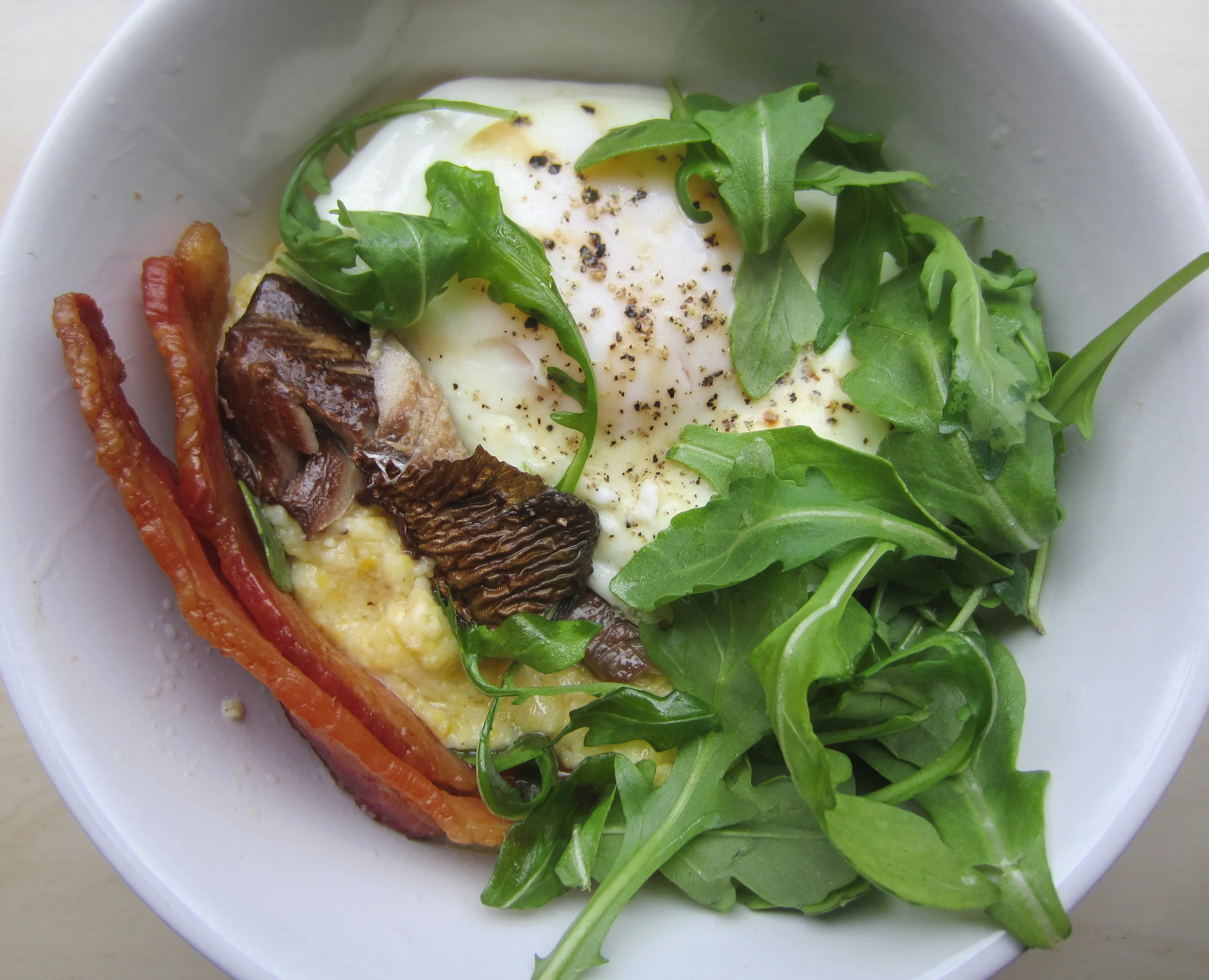  Smoked Herring &amp; grits. Experiment in savory breakfasts: blue cheese grits, poached egg, bacon, arugula &amp; smoked herring. Not as good as I wanted it to be. I think I'll stick to bread instead of grits. &nbsp; 