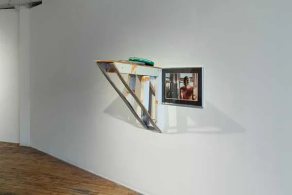 Jesse Butcher, Concealable, Removable, Available, Valuable, Enjoyable and Disposable , 2013. Wood, latex paint, aerosol paint, polyurethane, educational films, framed photograph, hardware. 29 x 29 x 30 inches
