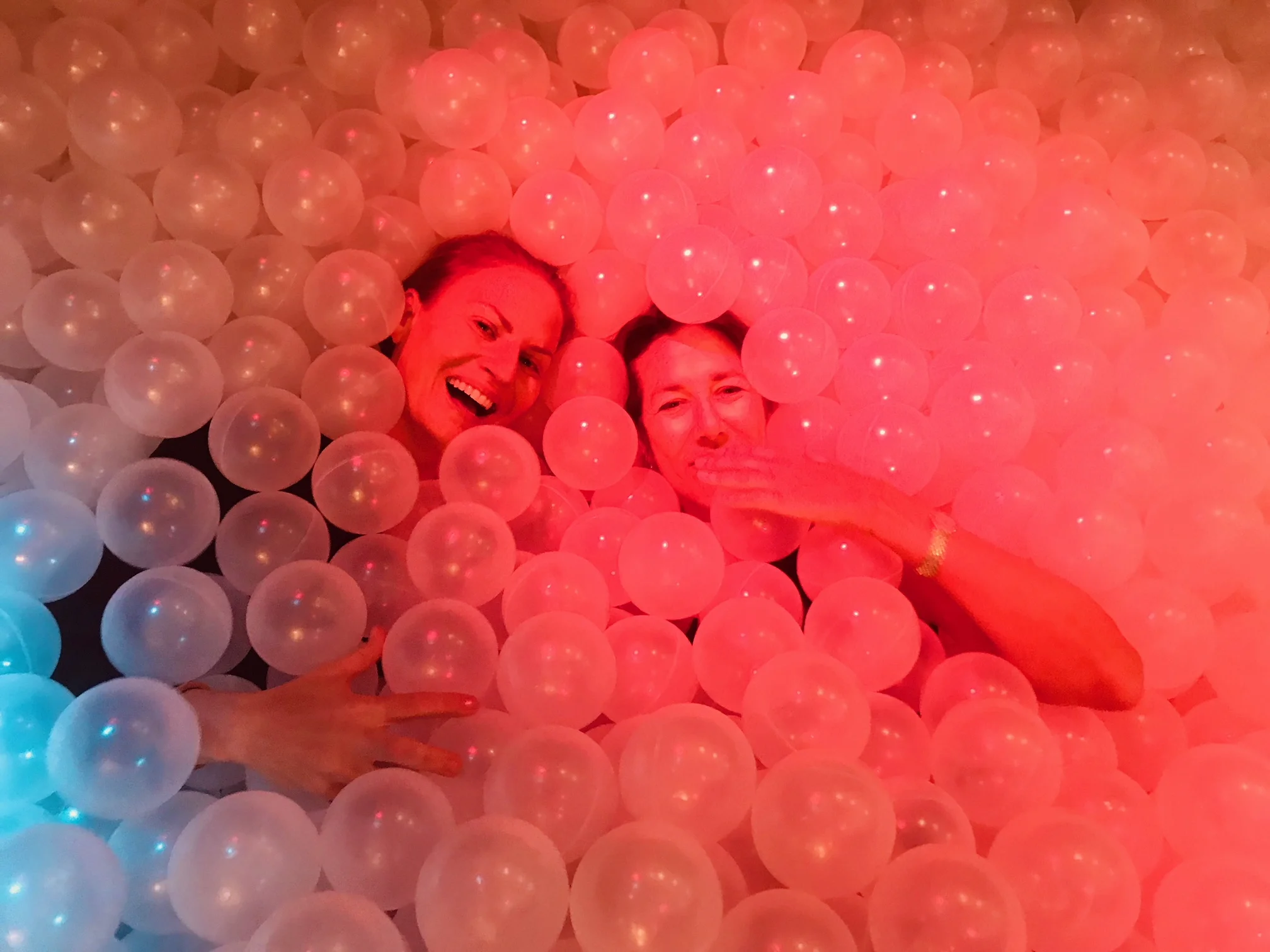 I’m, um, the dignified woman on the right. The pink balls are a reference to the bubbles in pink champagne.