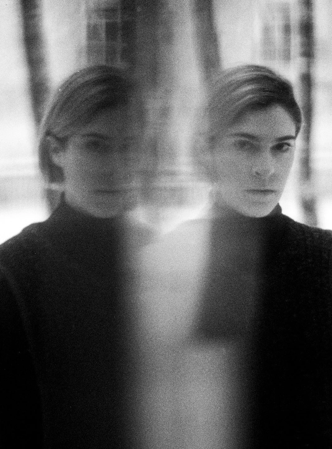 A refracted image of Alyssa looking at the camera.