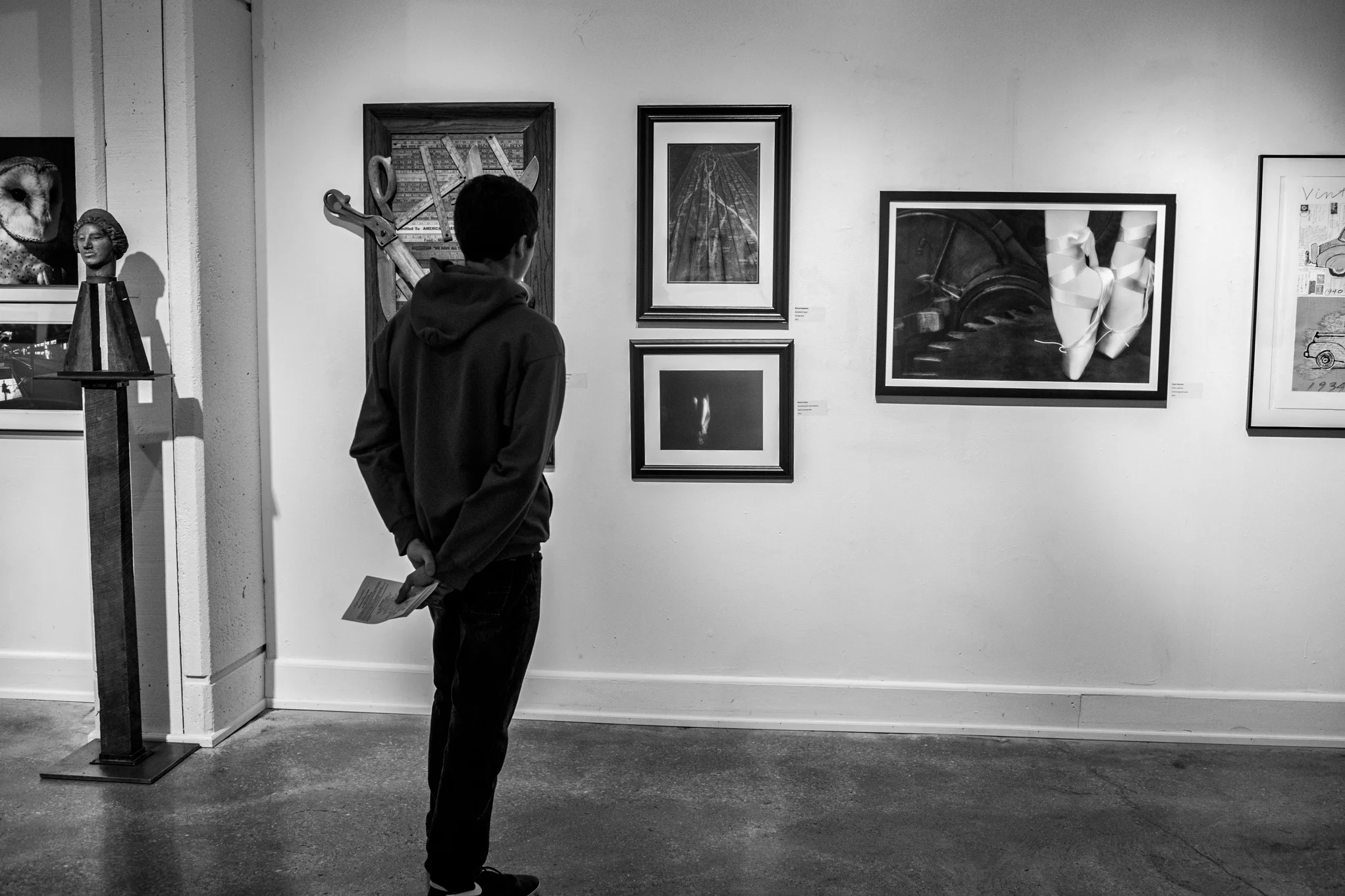 A big moment for me. My son is looking at my art hanging on a local museum's wall in my very first juried art exhibition. 