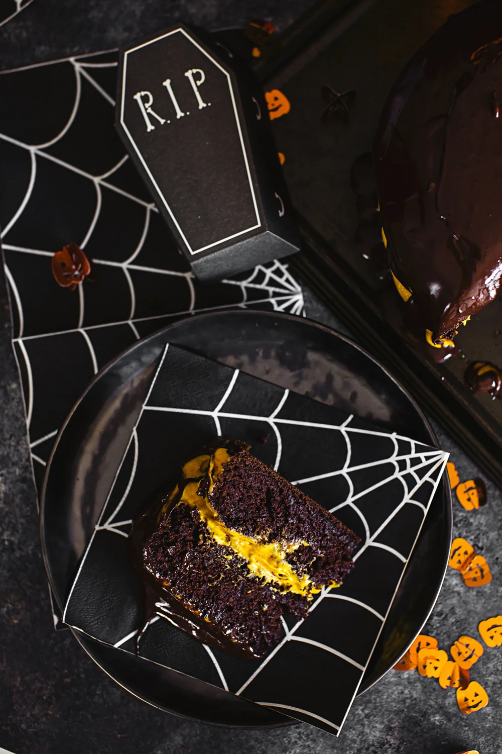Vegan Halloween Recipe: deliciously fluffy and moist Chocolate &amp; Pumpkin Cake, frosted with an Orange Cashew “Buttercream”.