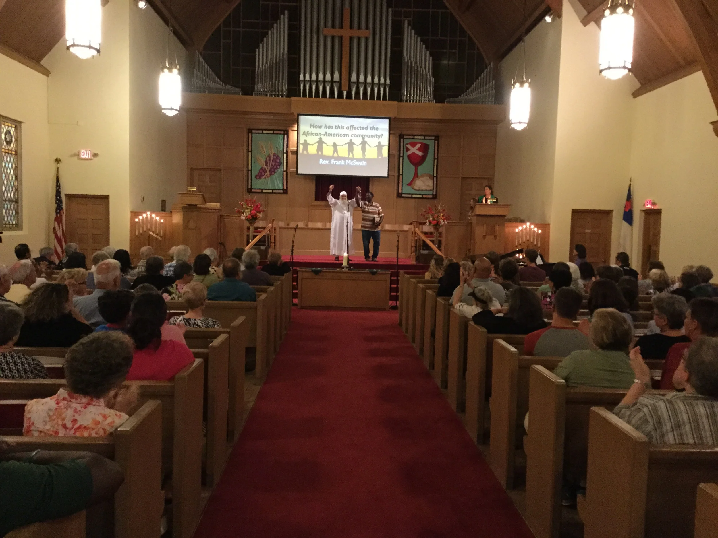 Imam Abu Emad and Mt. Pisgah Baptist Church Senior Past Frank McSwain join in a gesture of solidarity.
