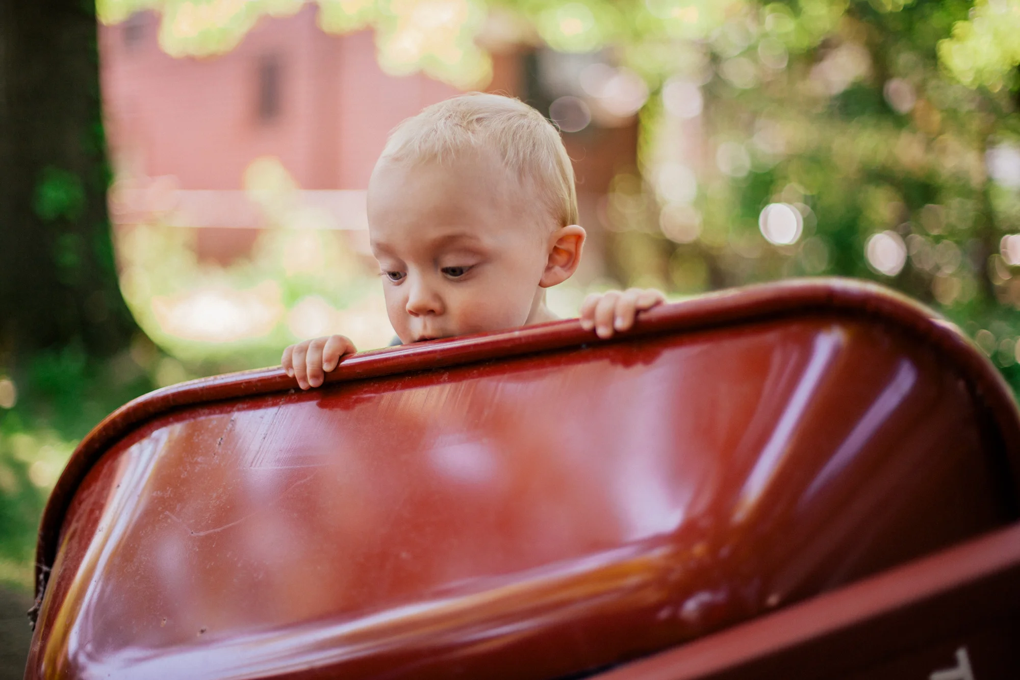 There's Oliver - curiously watching his grandpa put air in the wheelbarrow tire.