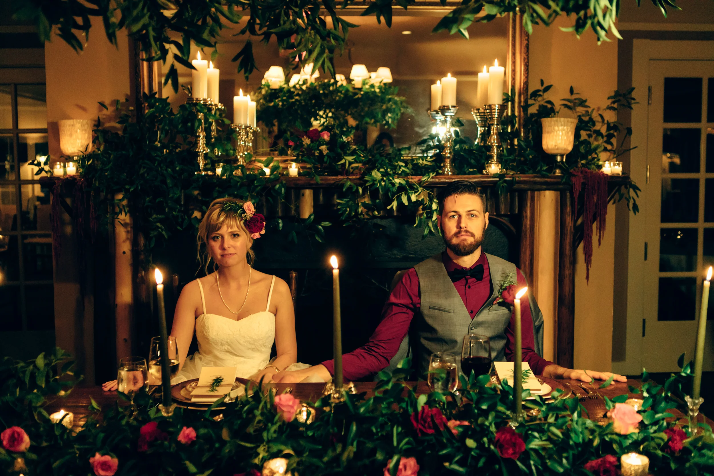 The candle-lit reception felt like mealtime in the Godfather. The couple happily obliged to a serious photo at the table.
