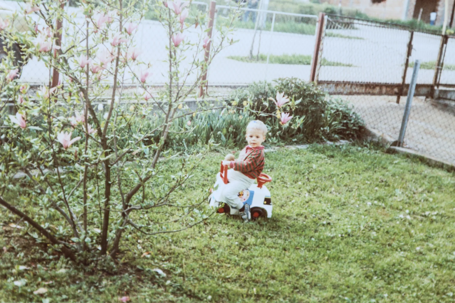 Two-year-old me in our front yard in Bosnia.