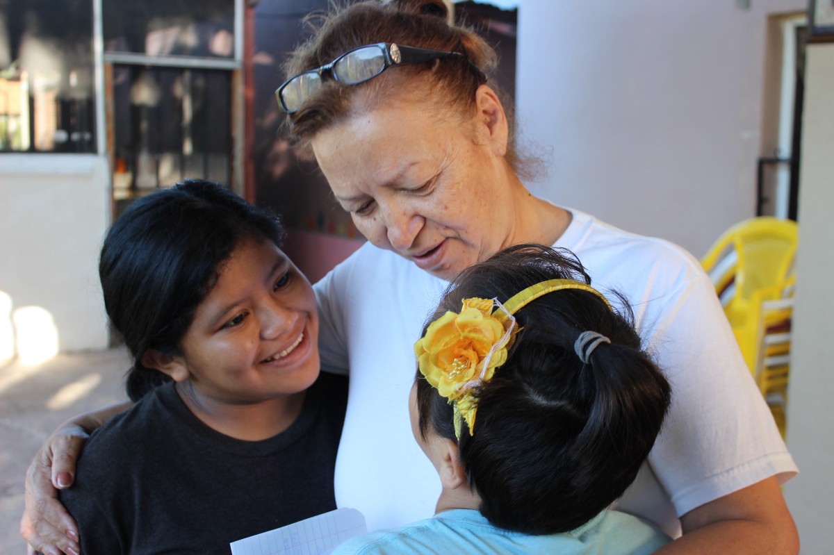 Mama Doris with Alejandra and Denia at the Foundation.