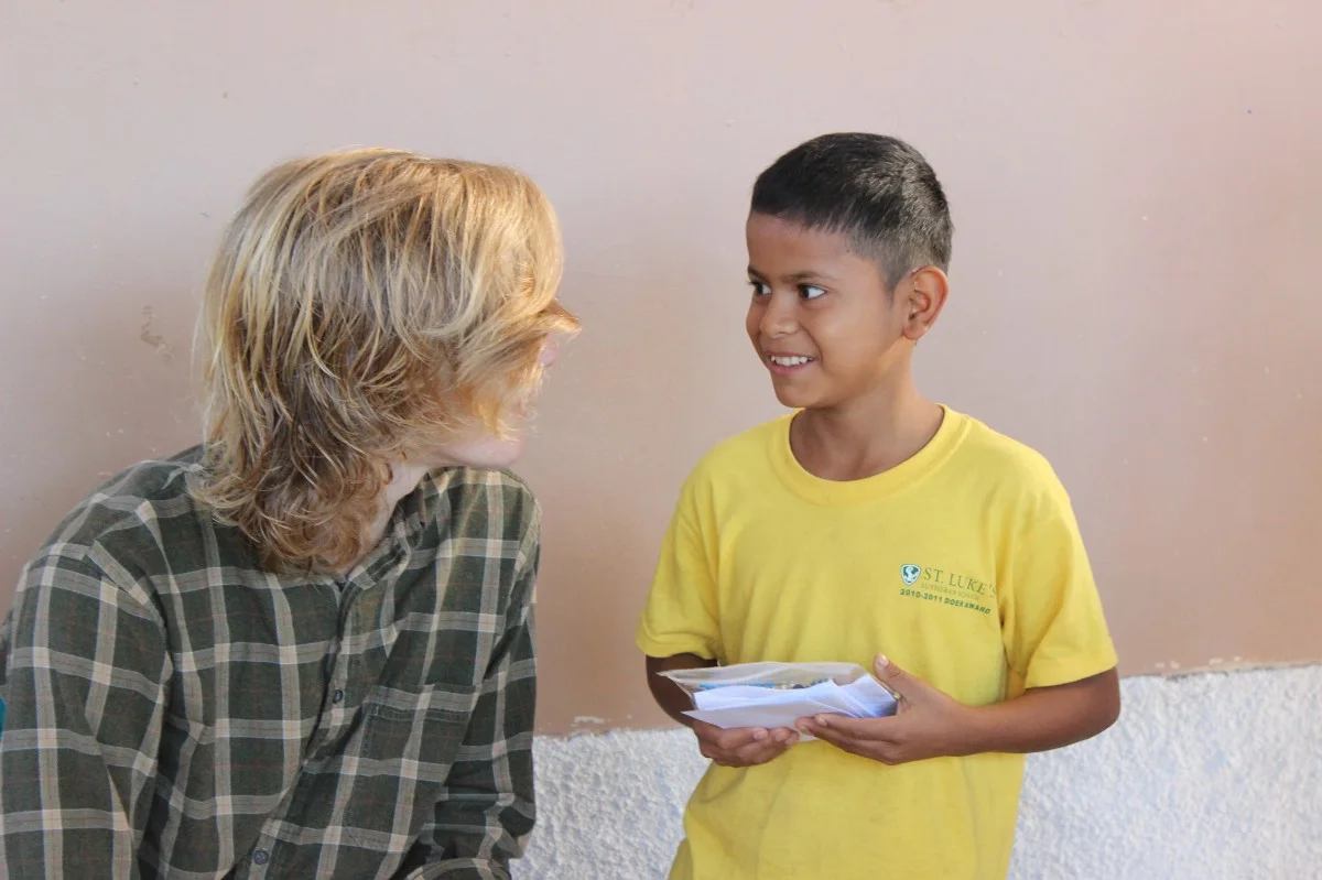 Thomas Simerville talking with Junior (photo by Mallory Lehenbauer).