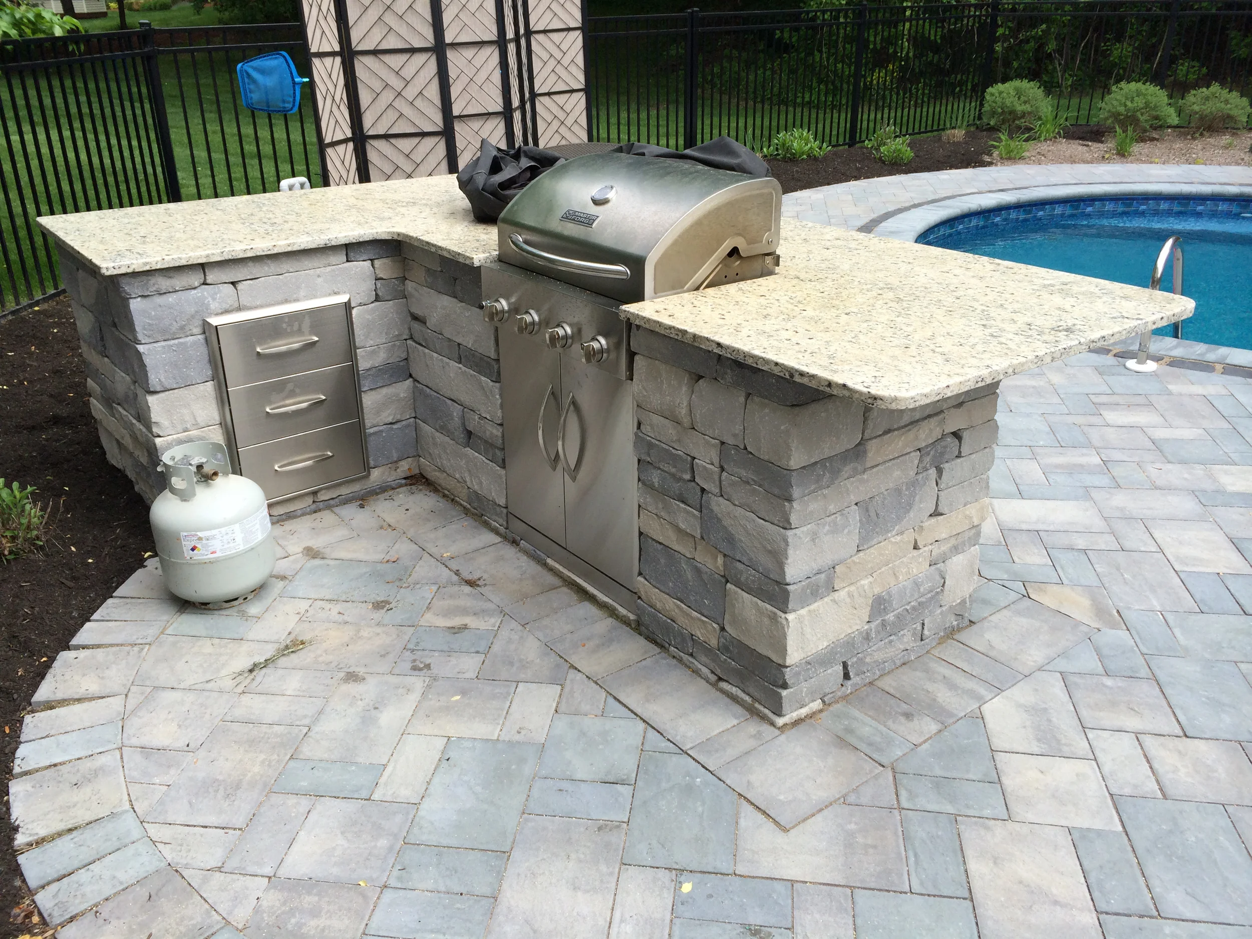 This is another example of a kitchen where we took a standard grill, removed sides, and then installed it into a masonry structure. Grills like this can be converted to NG or just left as propane.