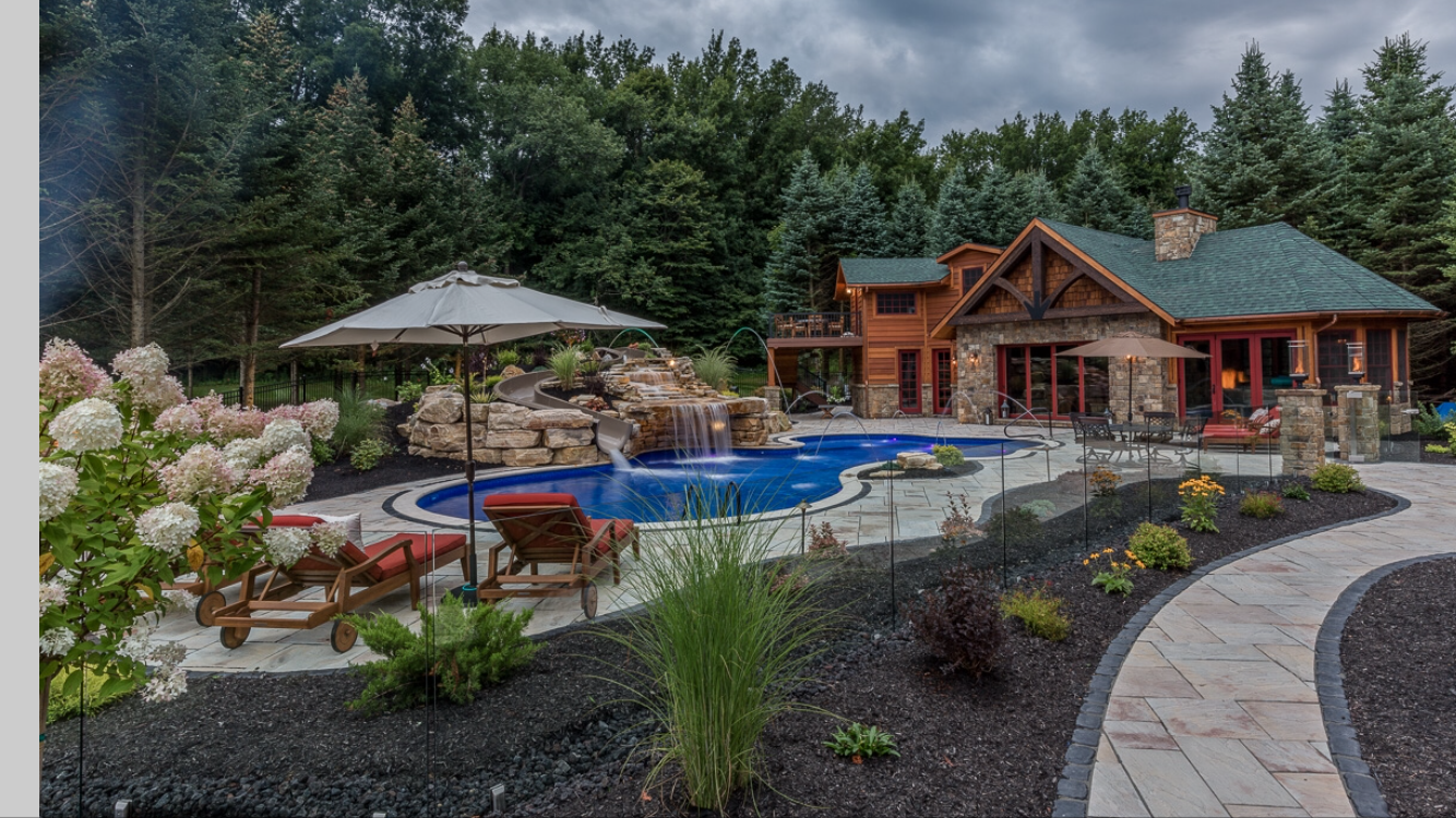 Backyard design and build Syracuse aerial view of pool, patio, pavilion and landscaping