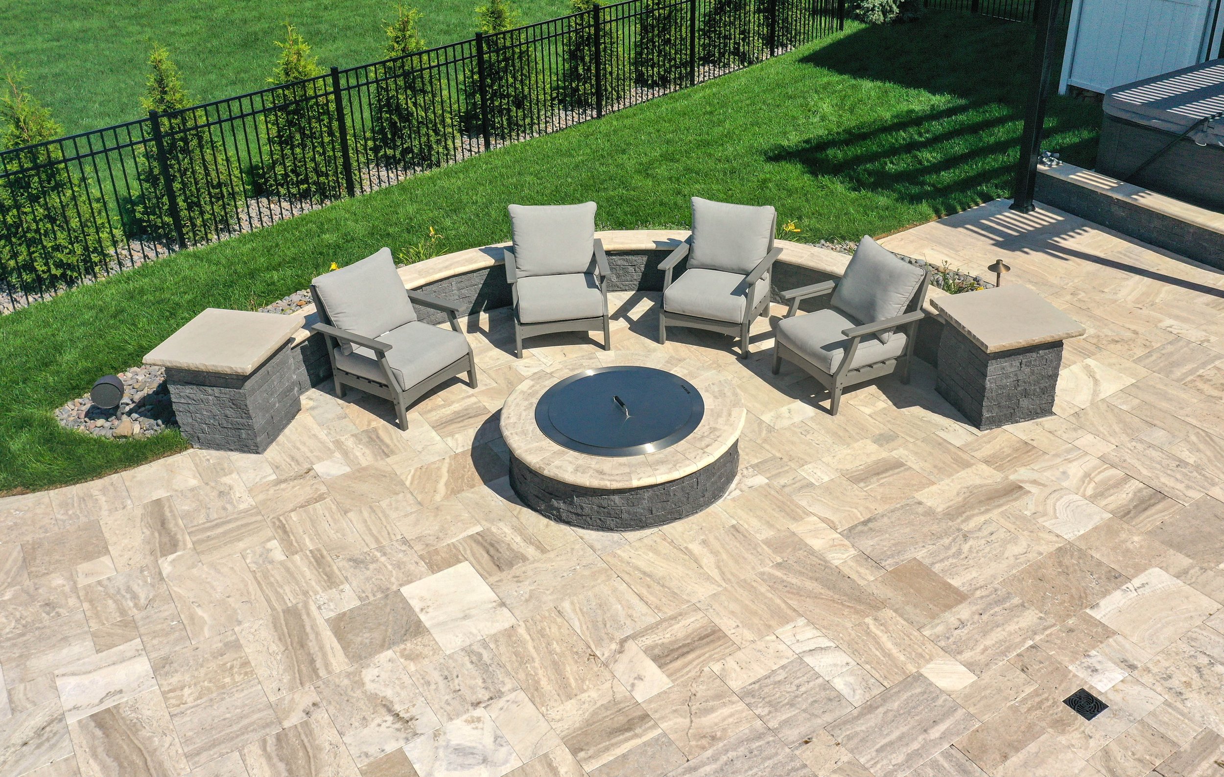 Murphy_Travertine_FirePit_SittingWall_MiniCreta_Limestone_caps_Drone.JPG