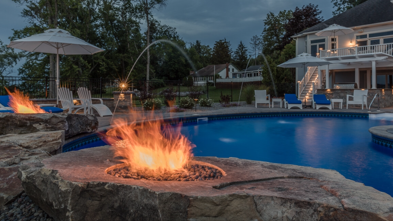 luxury-curvilinear-pool-pavers-hardscape-backyard-landscape-design-freeform-design-fire-boulder-with-deck-jets.png