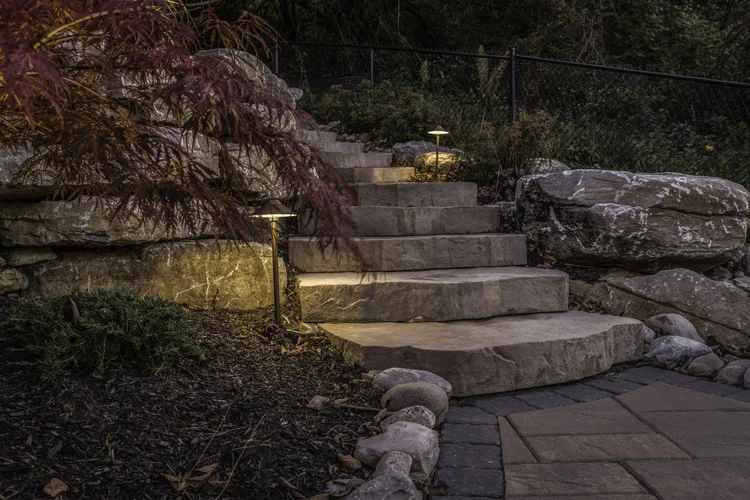 Low voltage landscape lighting installation on stone steps in Syracuse NY