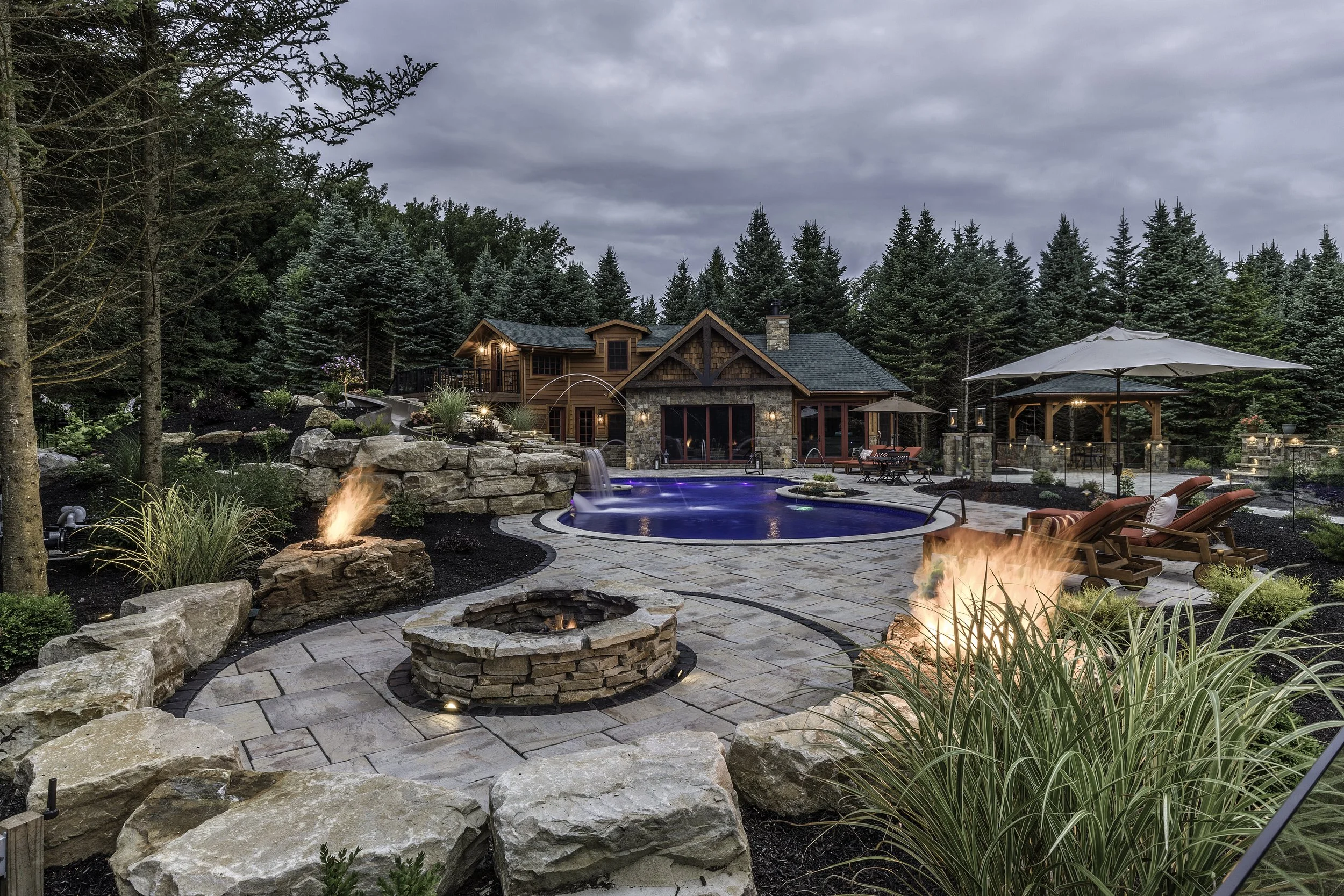luxury-curvilinear-pool-pavers-hardscape-backyard-landscape-design-freeform-adriondack-design.jpg