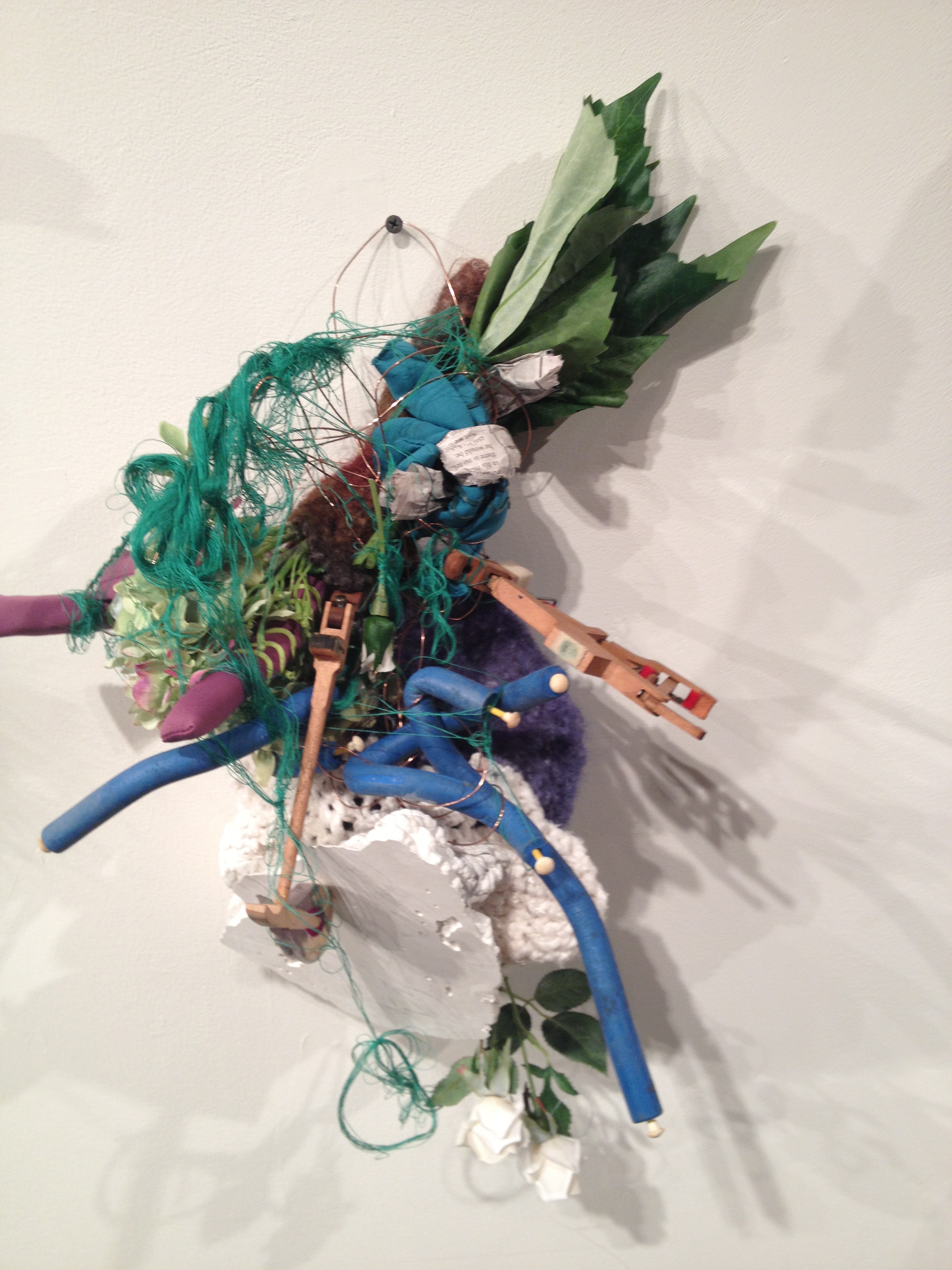 From Lunar Kind installation, 2013. Plaster, crocheted yarn, thread, hair curlers, artificial plant, newspaper, piano mallet, wire.