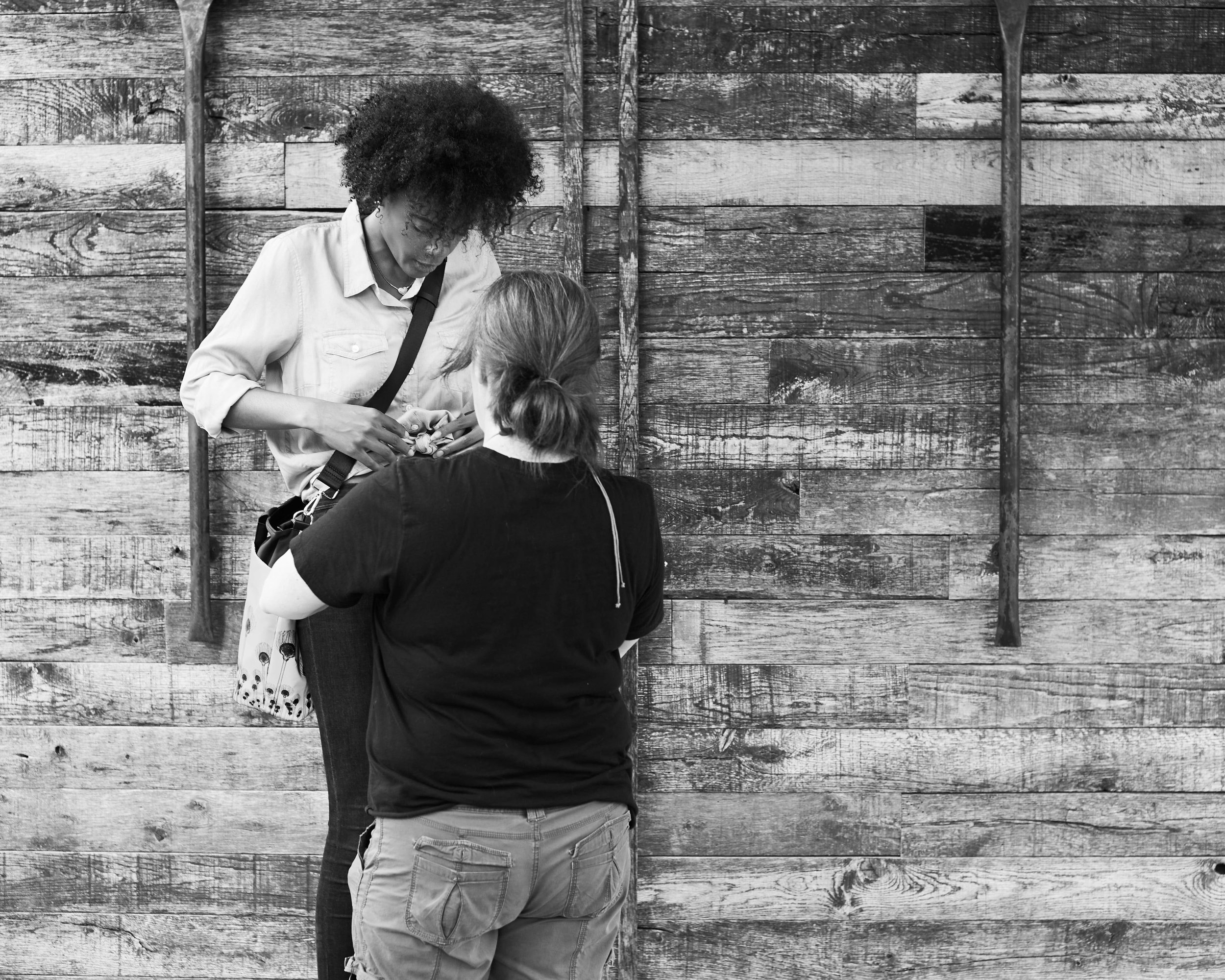 Sandi fixing the models wardrobe on location.