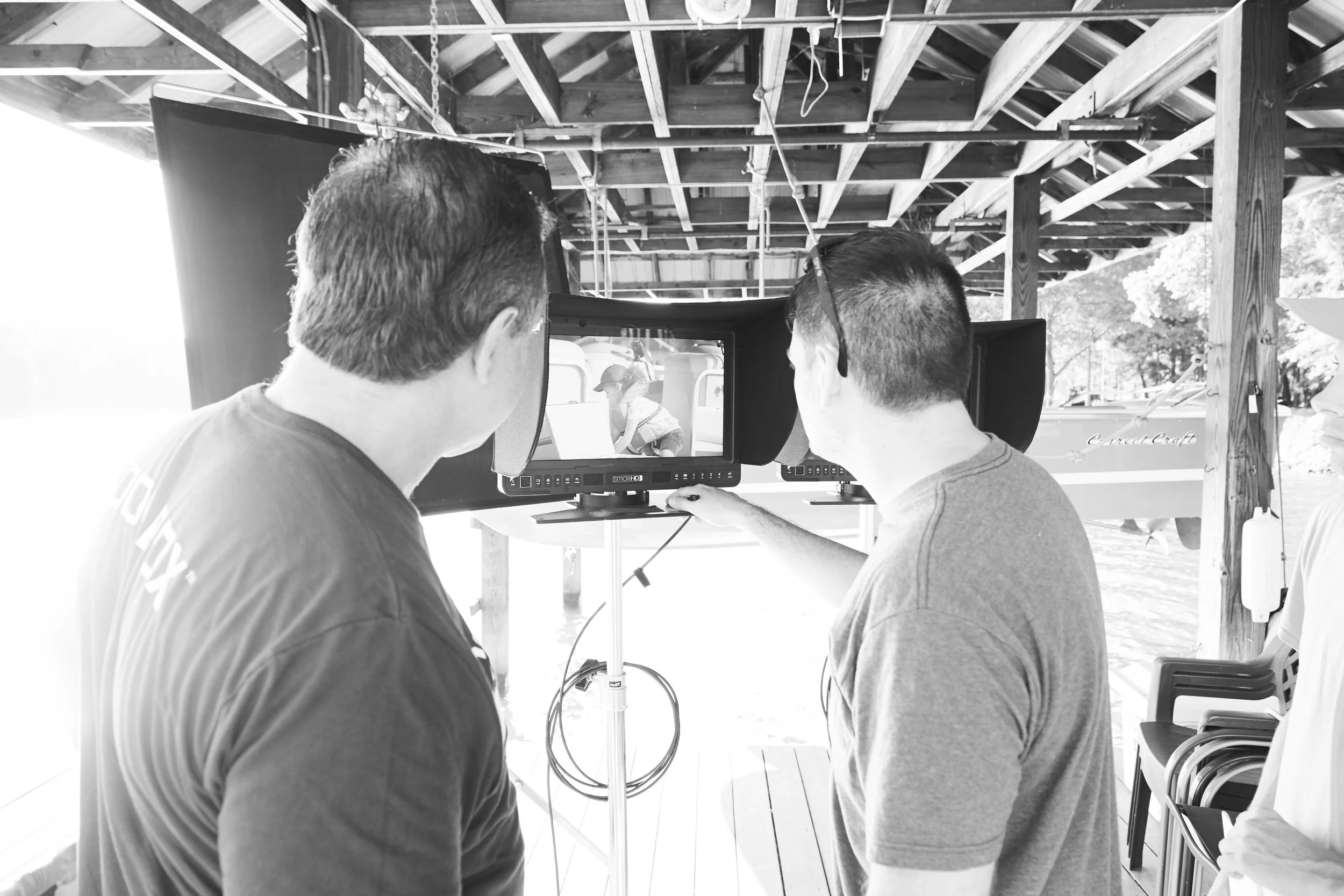 Client and Director reviewing on a video/still production for Coolerbox