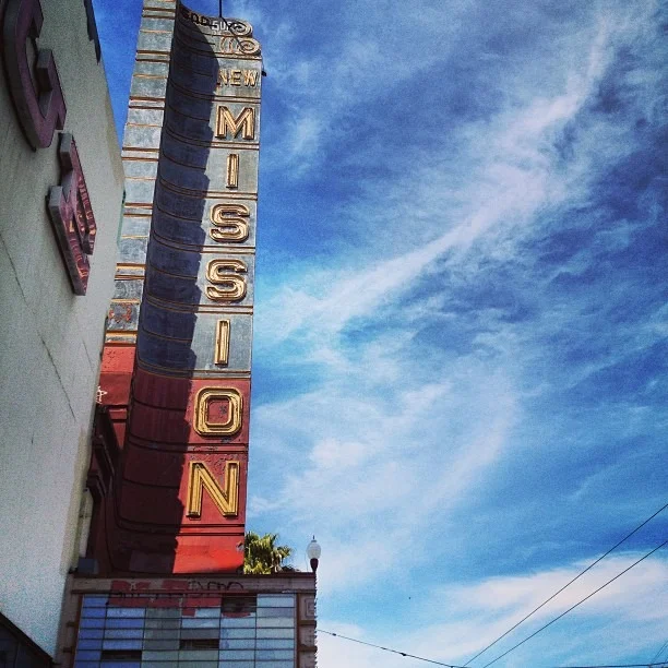 the #sunny #mish in the #bay #enjoying a #mural #scouting #day #missiondistrict #sf #vintage #theater #neonsign