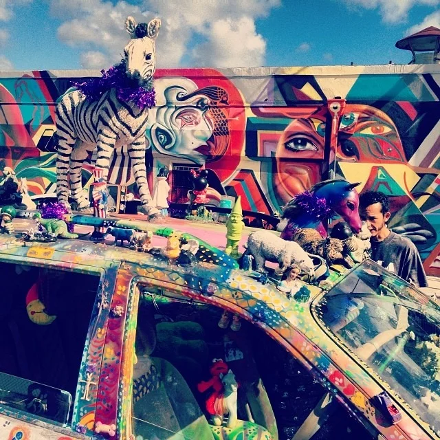 @w3rc helping the #art #visitors w directions #pony #unicorn #glitter #artcar #streetart #streetphotography #wynwood #miami #artbasel  #colorporn #psychedelic #travel  (at Wynwood Arts District)