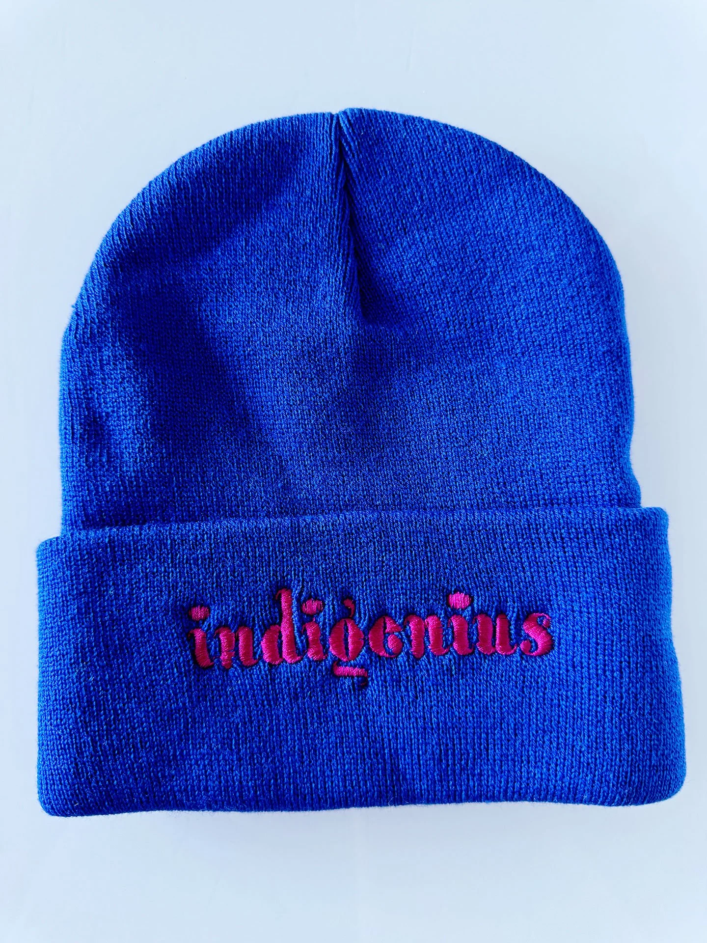 Geraluz-IndiGenius-beannies-2025-Blue_pinkLetters.jpg