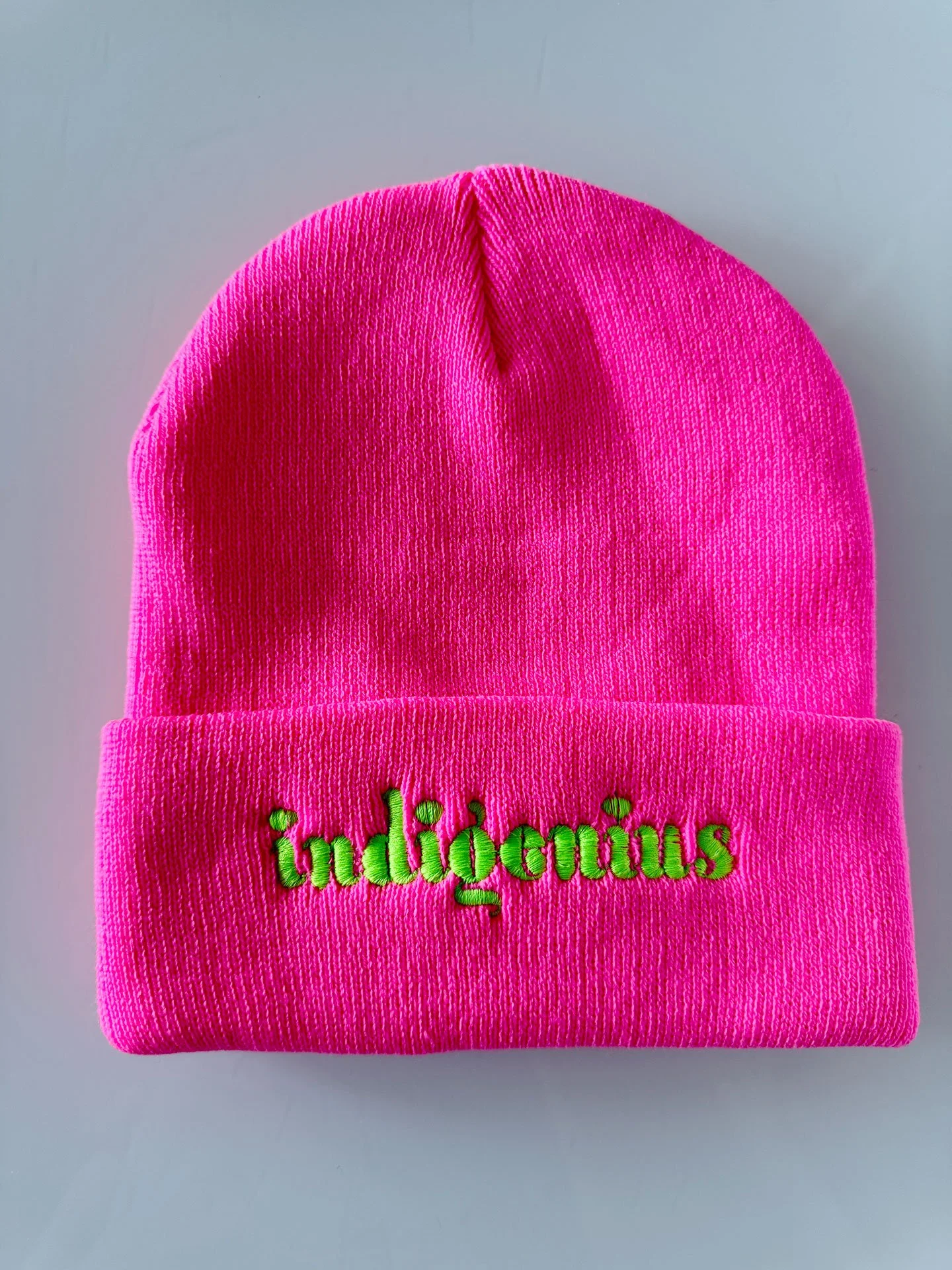 Geraluz-IndiGenius-beannies-2025-NeonPink_limeLetters.jpg