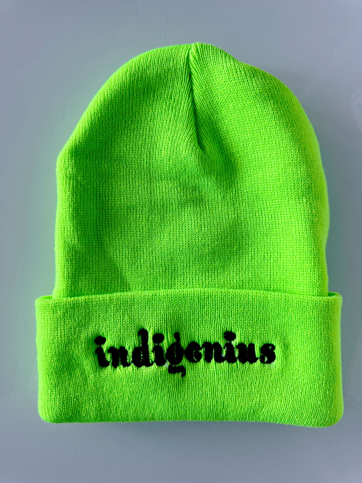 Geraluz-IndiGenius-beannies-2025-NeonGreen_blkLetters.jpg