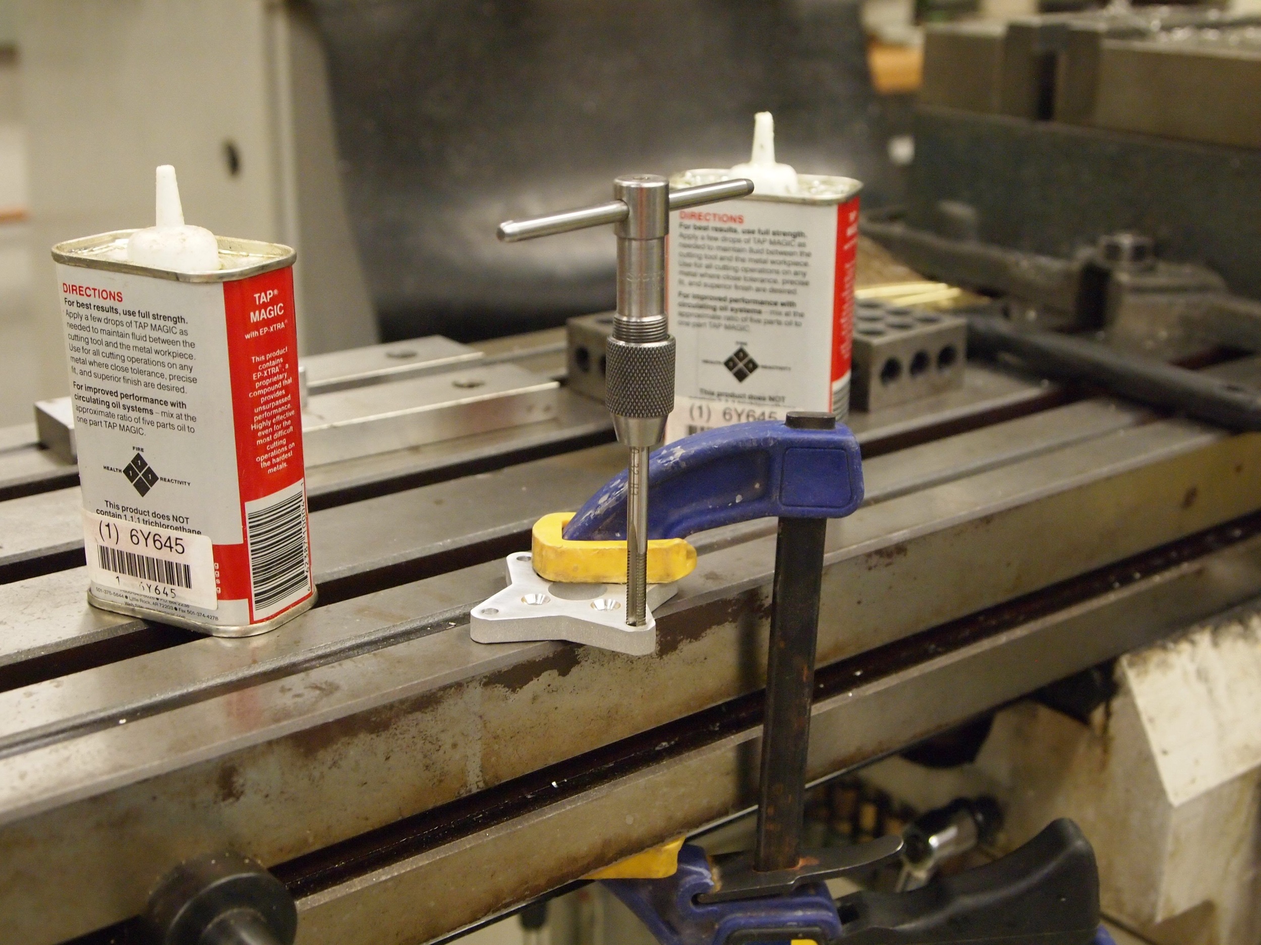Tapping the motor mounting plate.