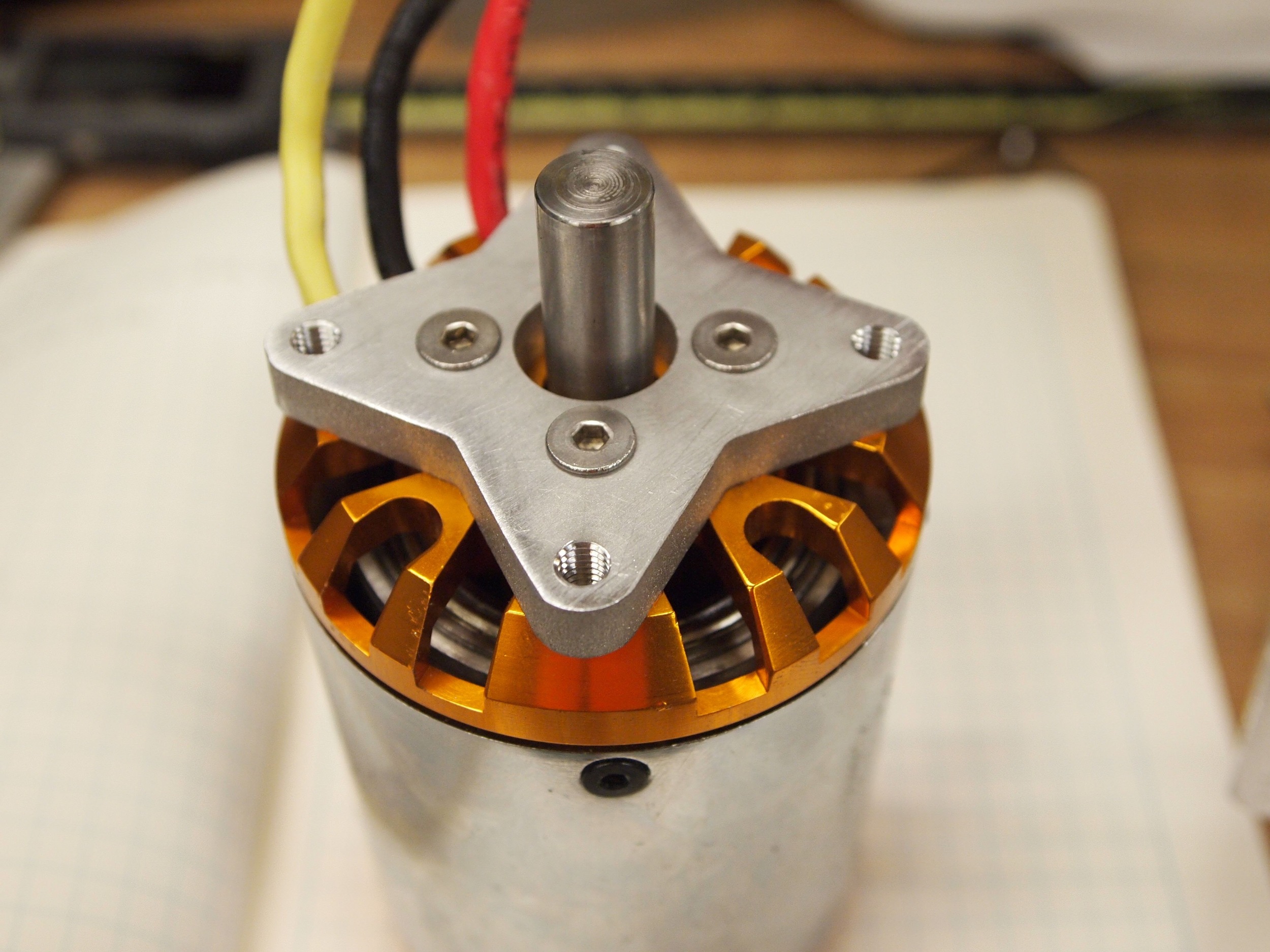 The motor mount attached to the motor. This is a large brushless motor which would typically be used to drive a propeller.