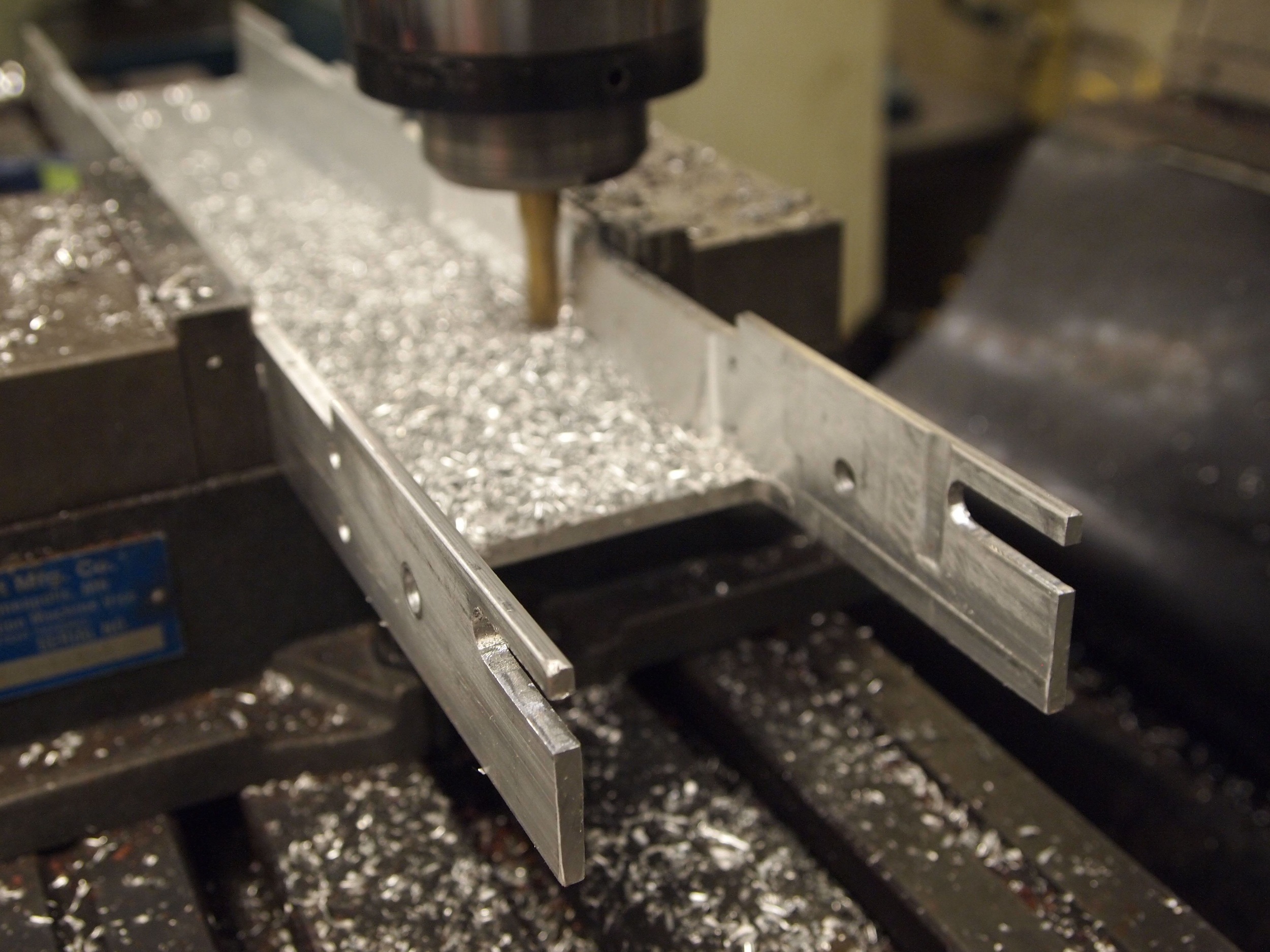Milling a flat on the inside of the U-channel, which made up the body of the scooter.