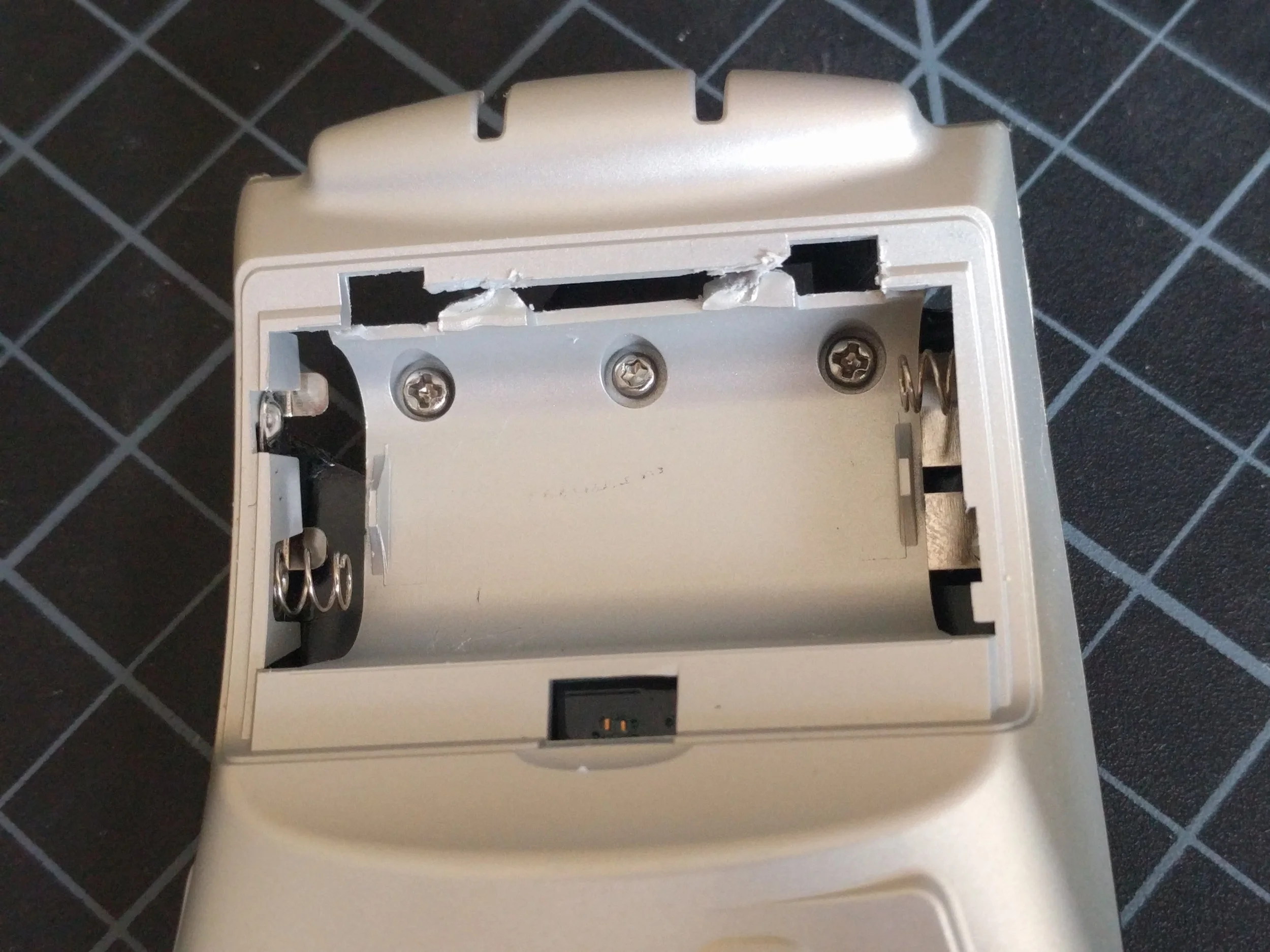 Weirdly, that middle screw is the only non-Phillips one in the whole assembly - a T6 head. 