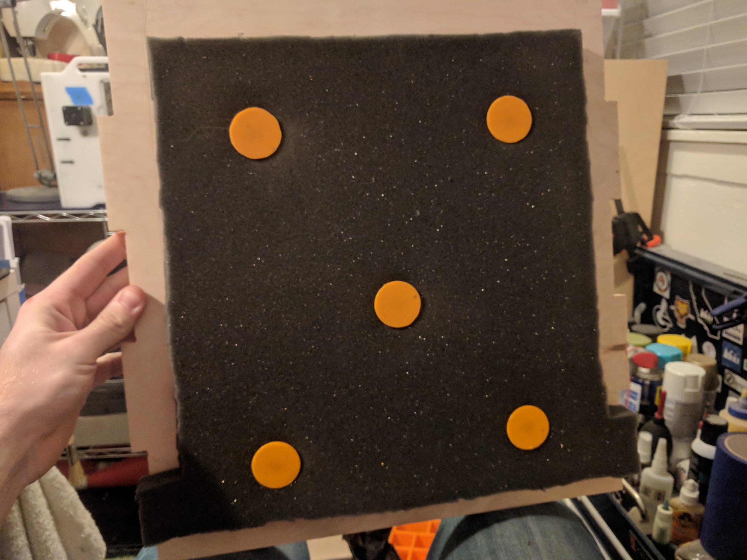  One of the panels with sound-dampening foam installed. The orange parts are 3D Printed with an M4 threaded insert installed for fastening to the wood. 