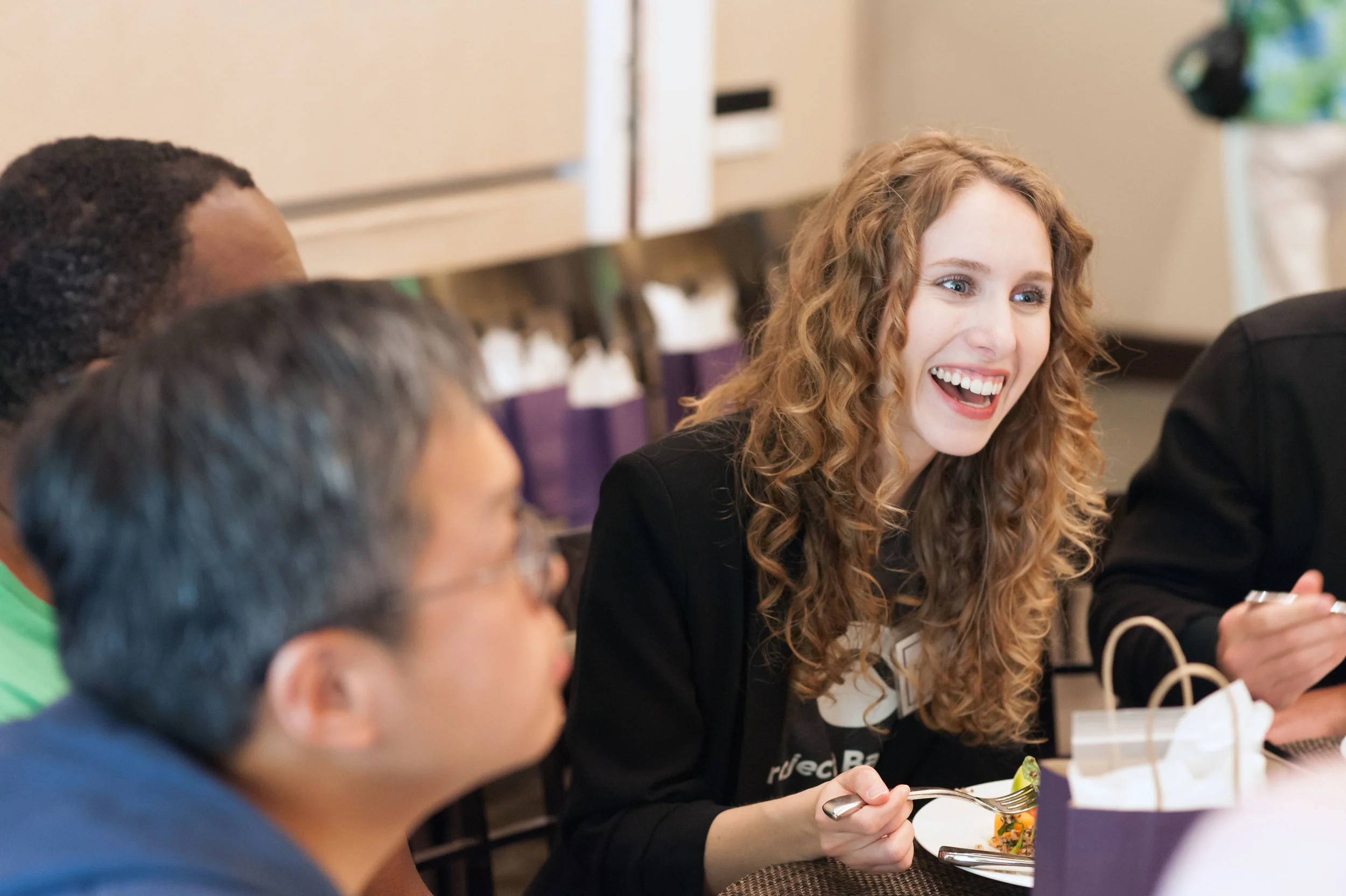 Event organizers enjoy a meal with study participants at the Stanford University Project Baseline Anniversary Event.
