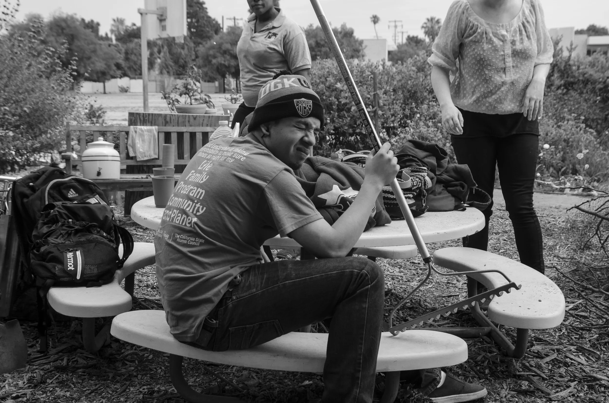  Arturo, 19, take a break from raking leaves at the Westminster Avenue Elementary School Garden. He along with a group of Venice YouthBulid students volunteer in the garden each month to help with maintenance and upkeep. (May 2015 | Venice, CA)      