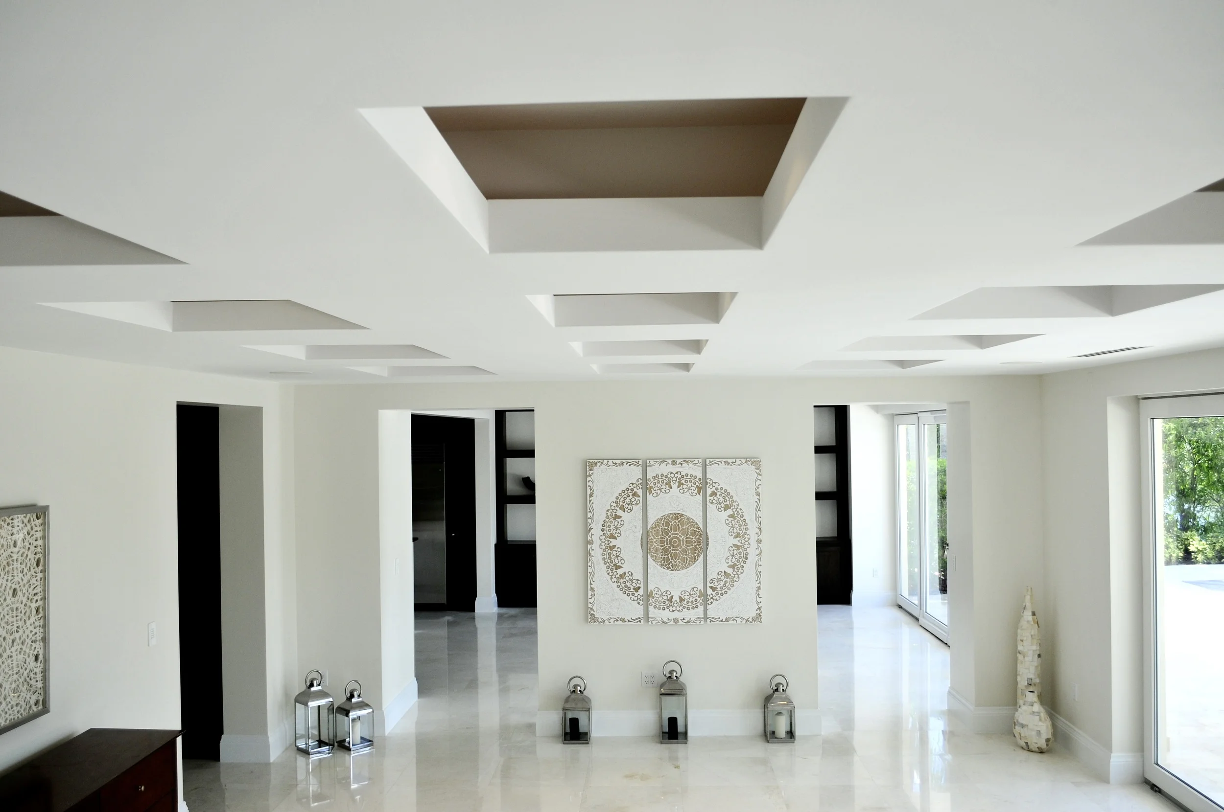 Chocolate box ceiling with LED accent lighting inside. The living room flows in to the kitchen living area..jpg
