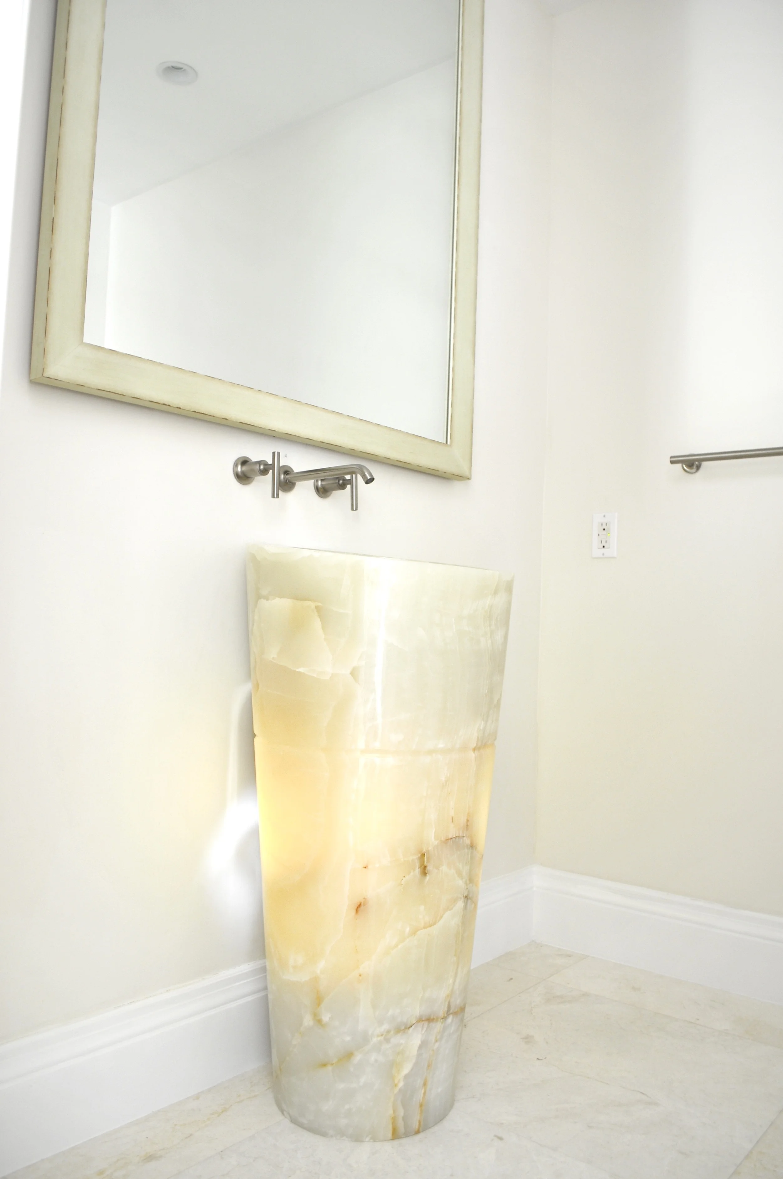 Sink made from one piece of Onyx from Stone Forest To make the pedestal sink interesting we back lit it from the inside.jpg
