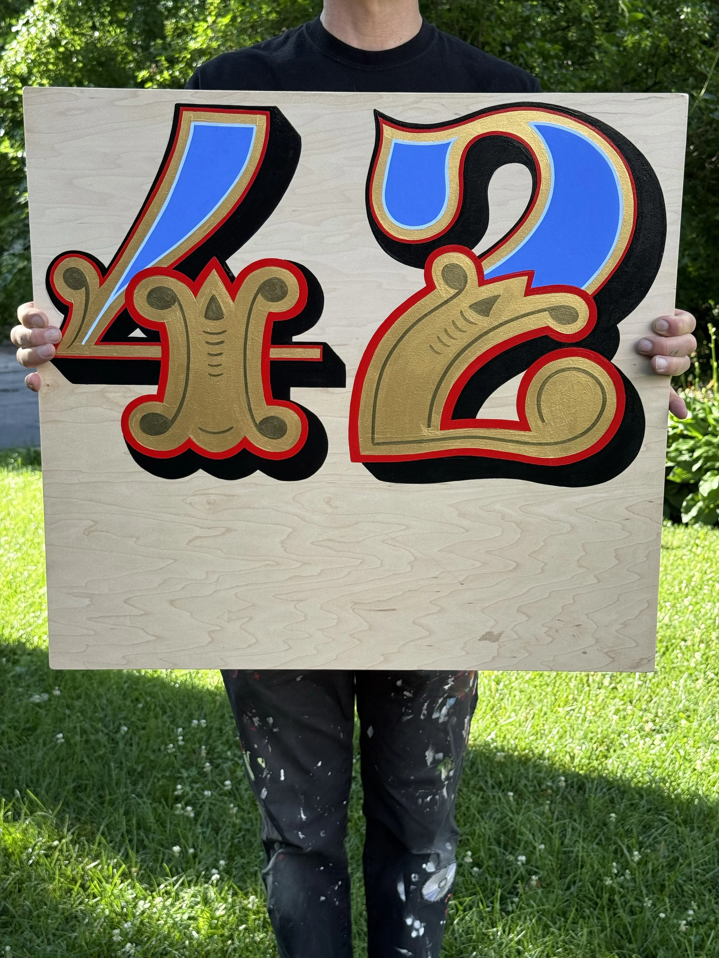 New sign painting on a scrap piece of wood - the number 42