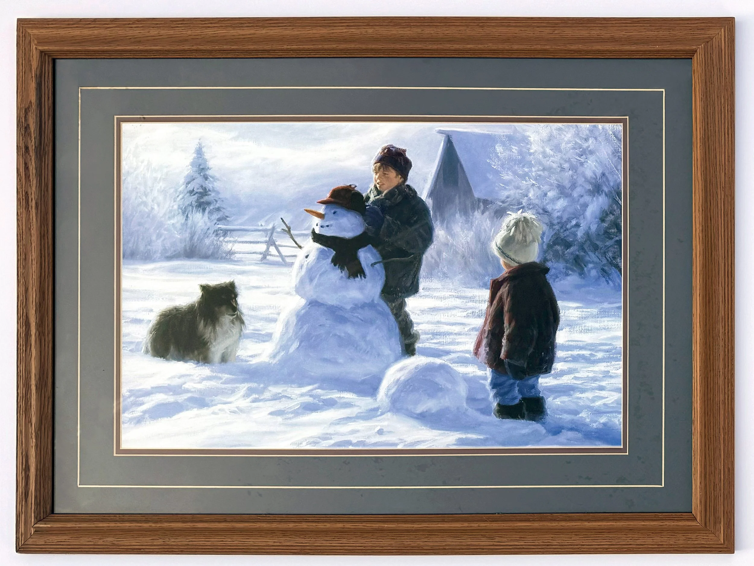 Framed painting of a boy building a snowman with a dog and another child observing from the sides.