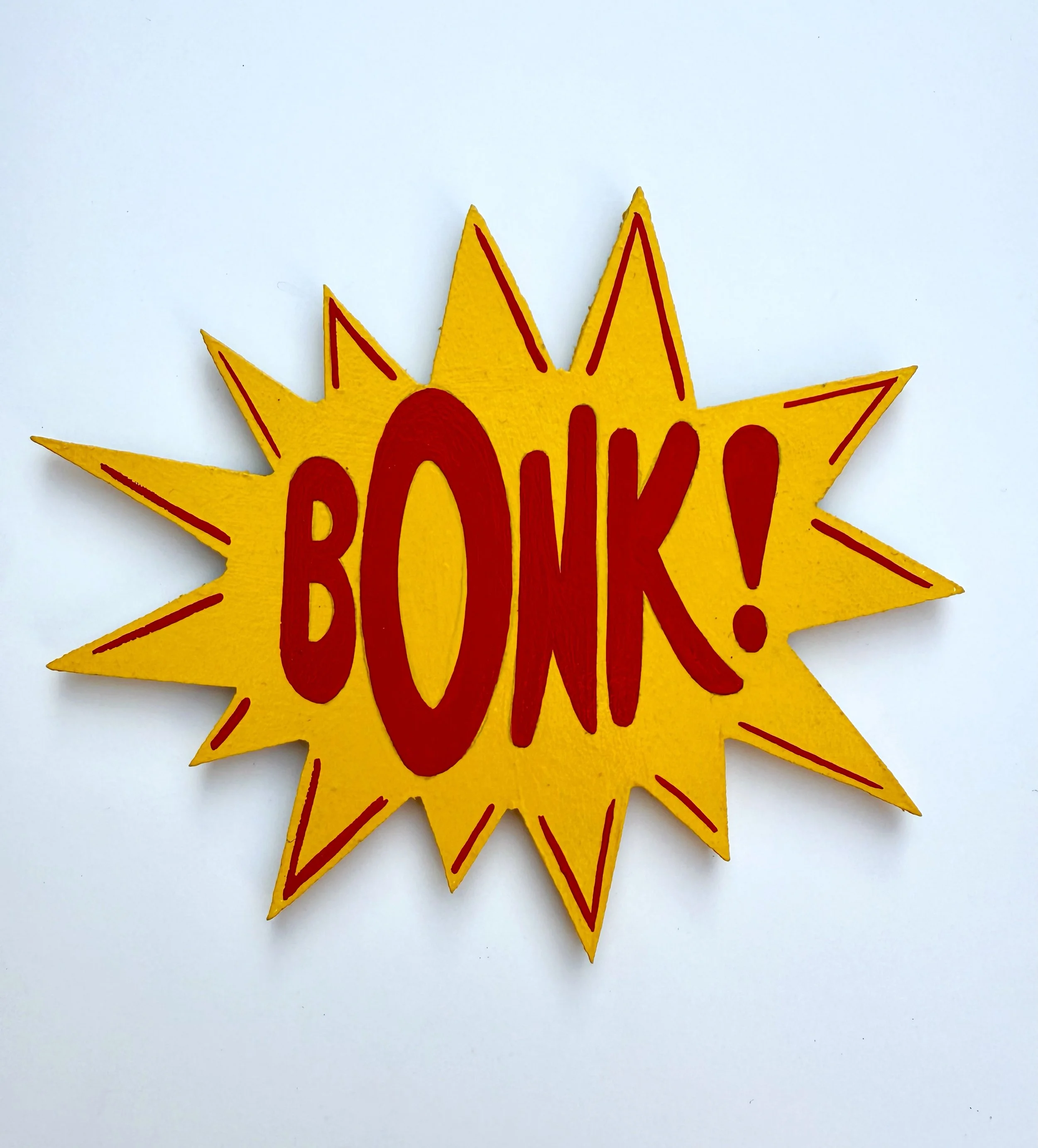 BONK! painted red on a yellow burst