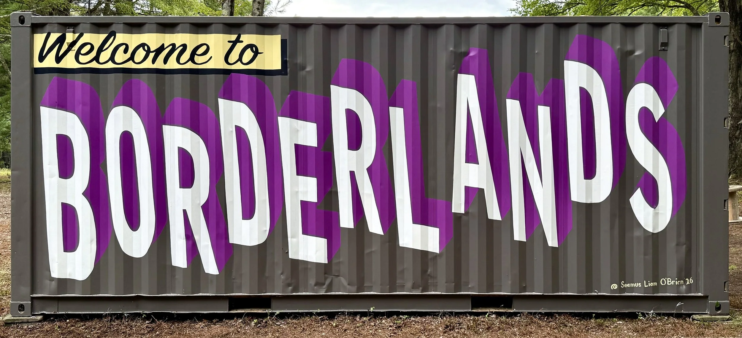 Welcome to Borderlands painted onto the side of a grey shipping container