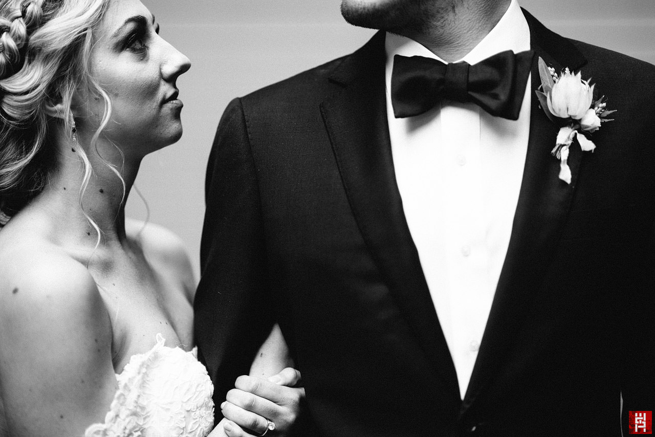 052-black-white-bride-groom-creative-portrait-tight-closeup-58mm-suit-dramatic.jpg