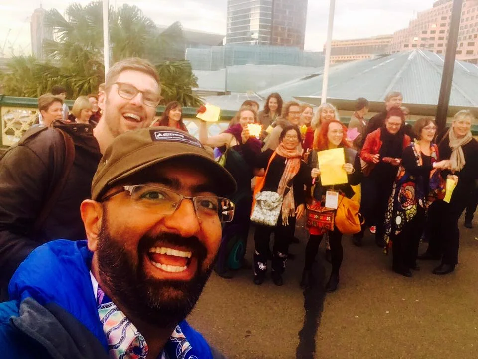 Photo of us organising a happiness flashmob in Sydney outside the Happiness and Its Causes Conference